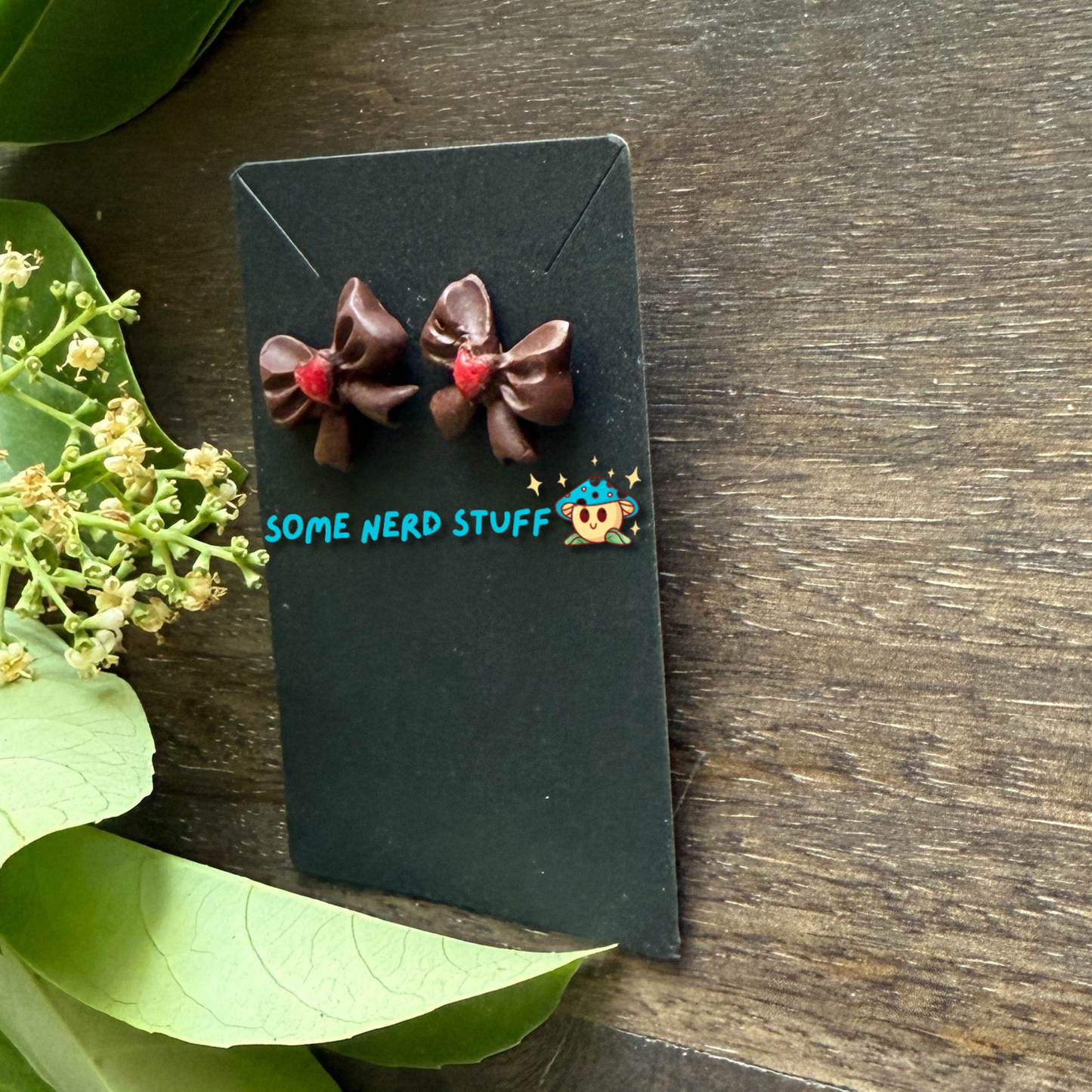 Chocolate bows with red heart center polymer clay handmade earrings by SomeNerdStuff
