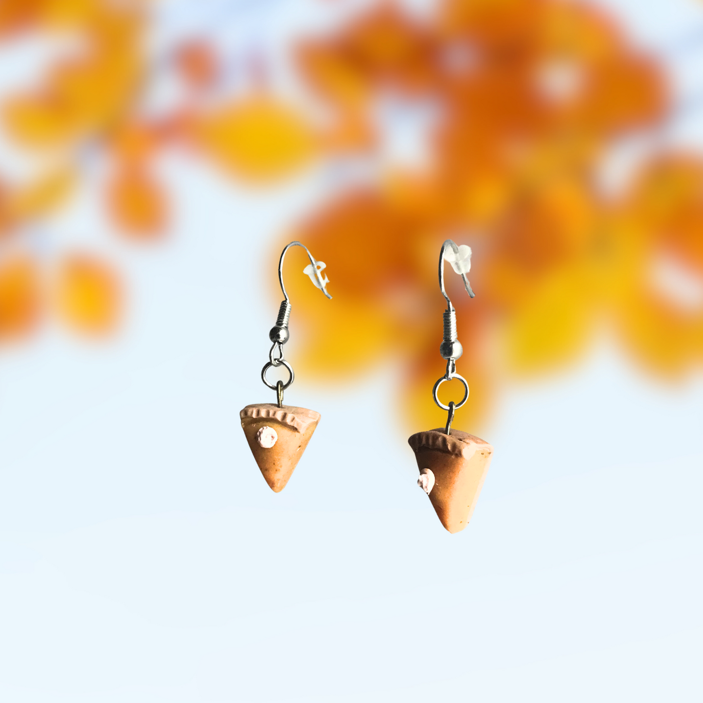 Polymer Clay Pumpkin Pie earrings with a dot of whipped cream made by SomeNerd Stuff