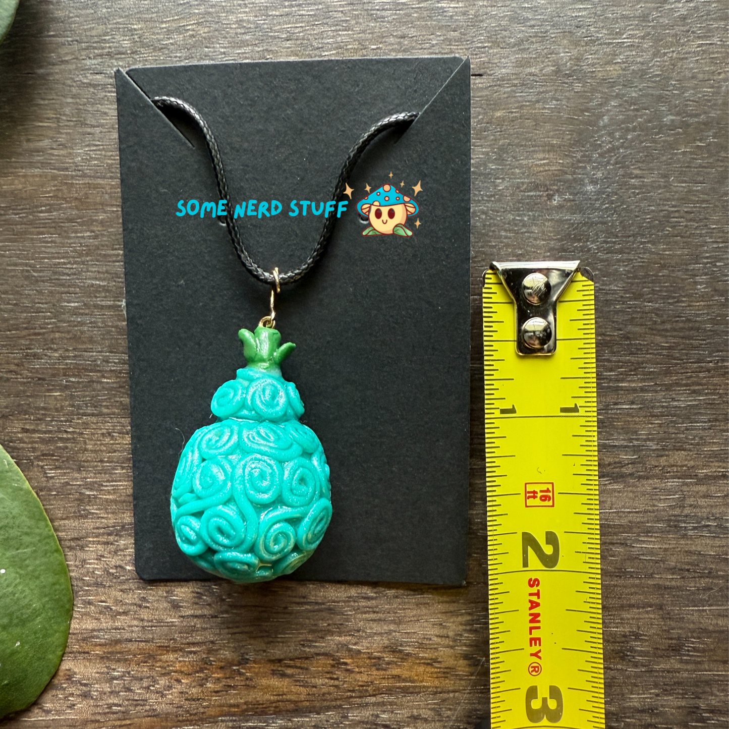 Omo Omo No Mi Devil Fruit Charm Necklace with measuring tape to show size