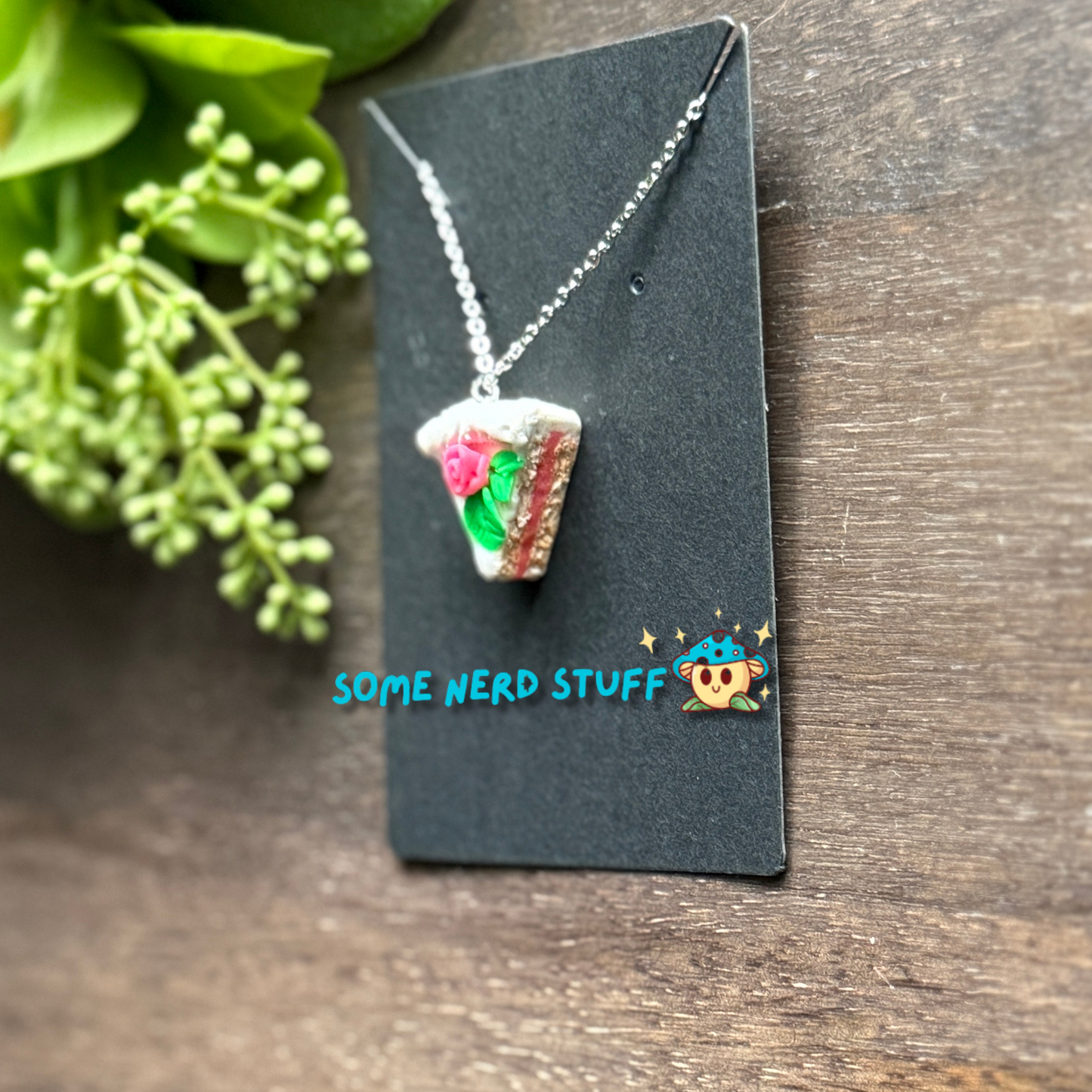 Pretty in Pink Polymer Clay necklace top view with pink rose and green petals side view with pink glaze