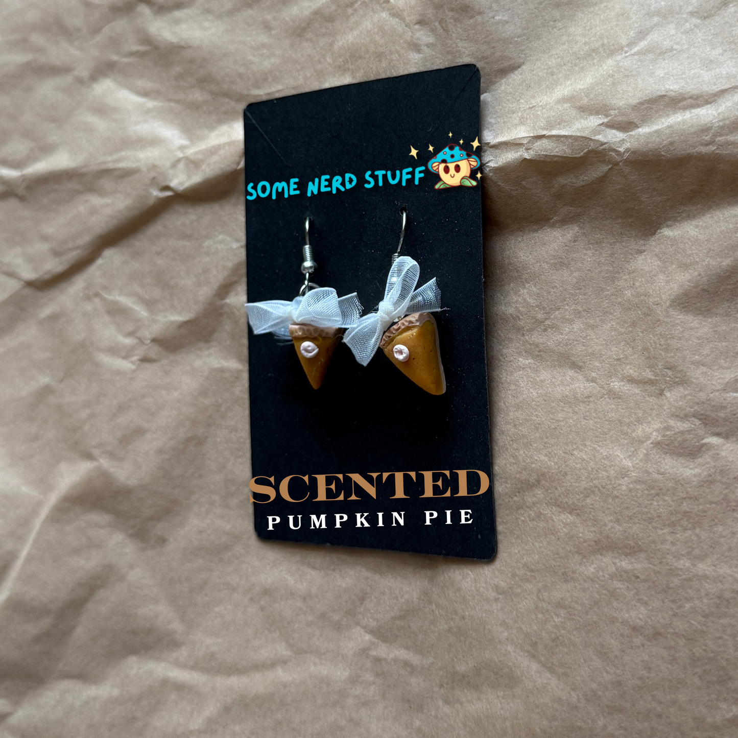 Scented Polymer Clay Pumpkin Pie Dangling Earrings showing side view made by SomeNerdStuff