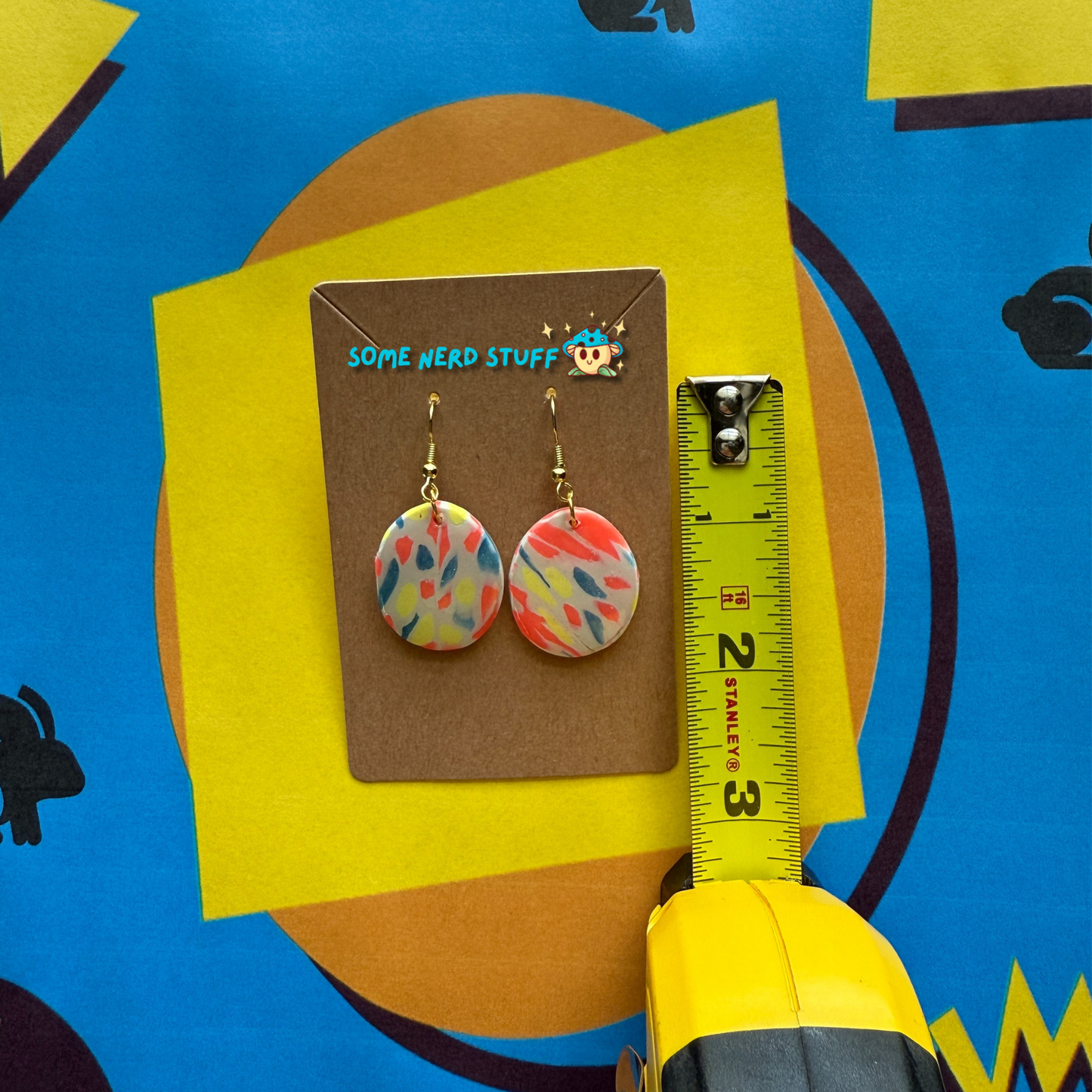 Elliptical Polymer Clay Earrings inspired by Saved by the Bell 90s show multicolor shown with measuring tape made by SomenerdStuff