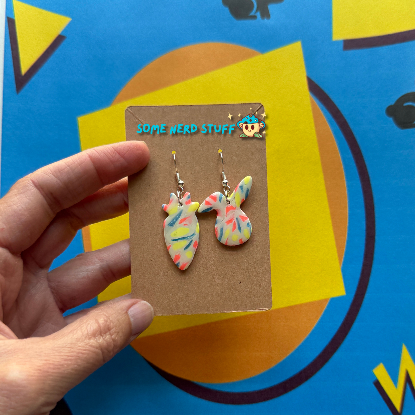Bunny Head and Carrot Polymer Clay Earrings inspired by Saved by the Bell 90s show multicolor show with hand to show size made by SomenerdStuff