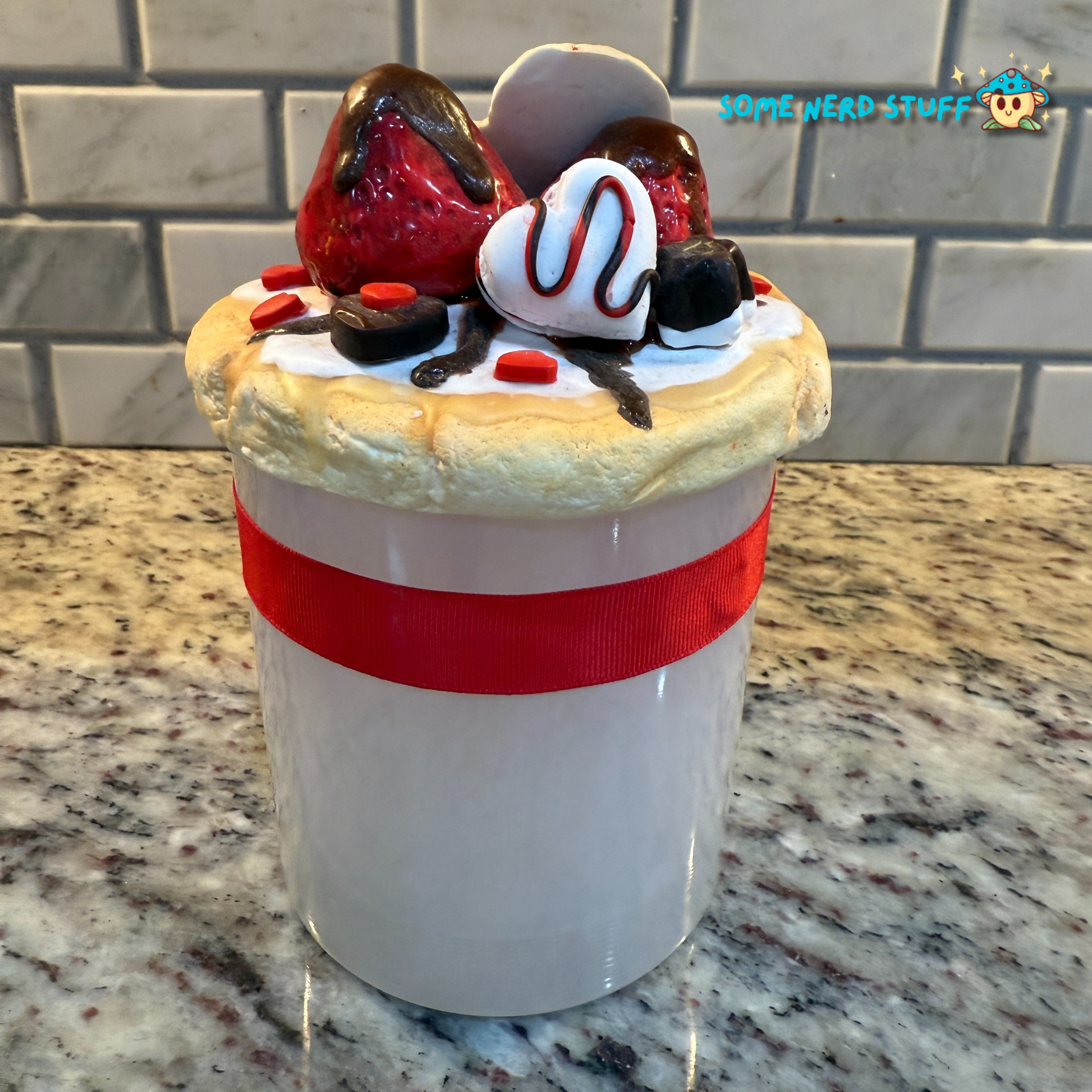 Stash Jar or Cookie Jar that is made of polymer clay over a glass jar. Decorated with clay macarons, chocolates, and dripping in chocolate glaze back of jar. Made by SomeNerdStuff.