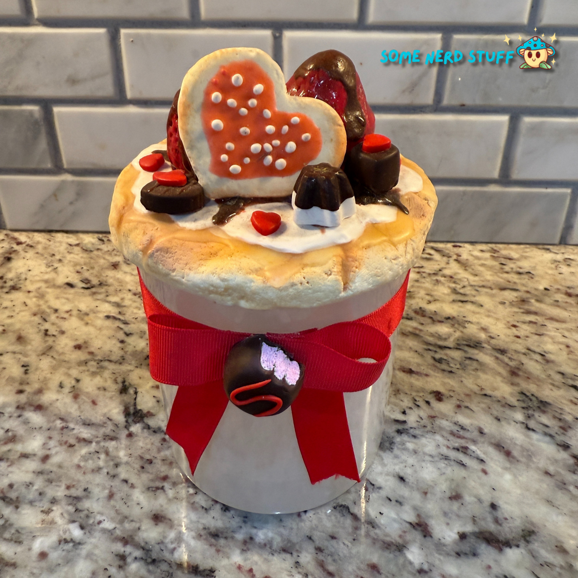Stash Jar or Cookie Jar that is made of polymer clay over a glass jar. Decorated with clay macarons, chocolates, and dripping in chocolate glaze front of jar. Made by SomeNerdStuff.