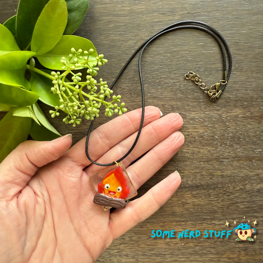 Calicifer Polymer Clay and Resin charm hung from necklace made by SomeNerdStuff
