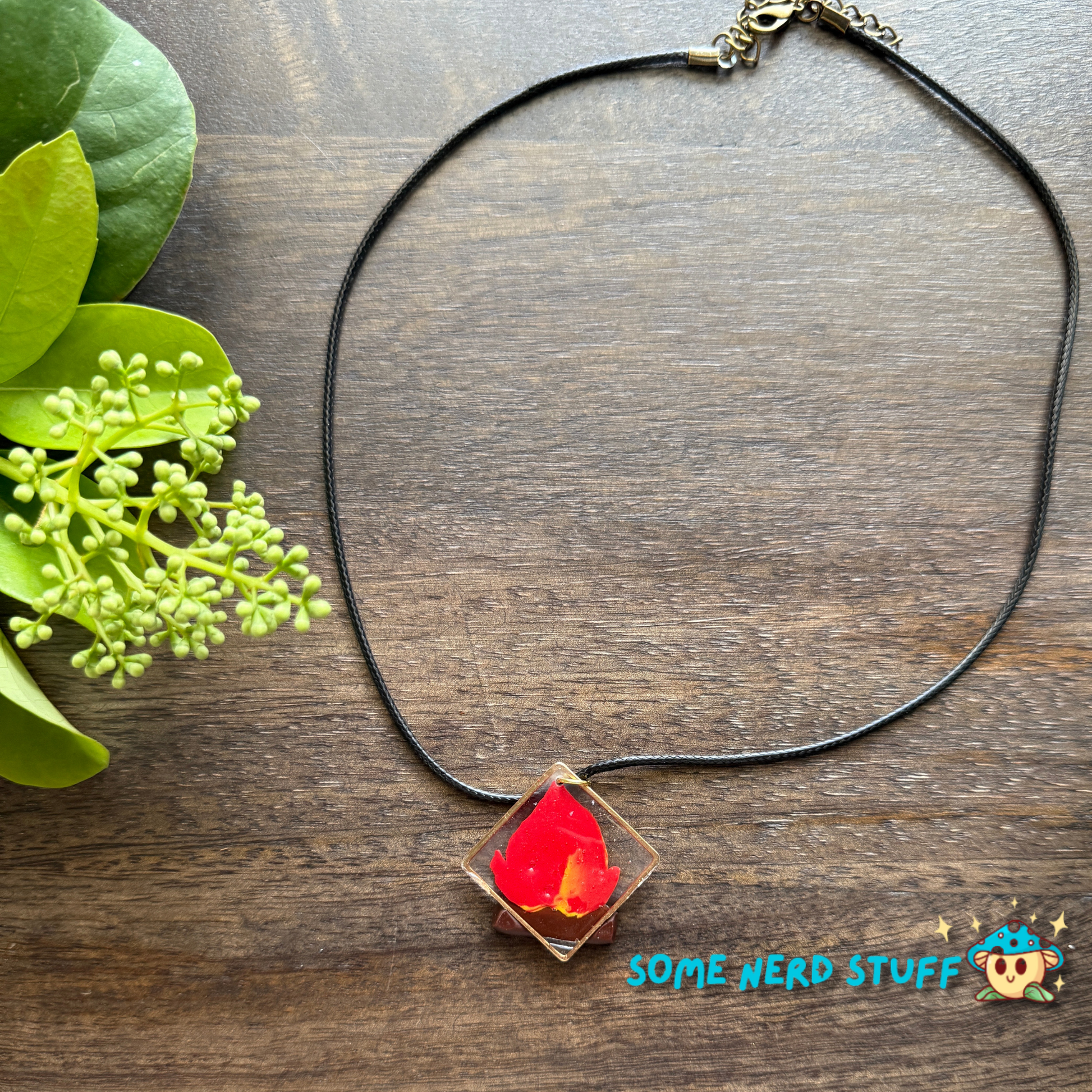 Calicifer Polymer Clay and Resin charm hung from necklace made by SomeNerdStuff