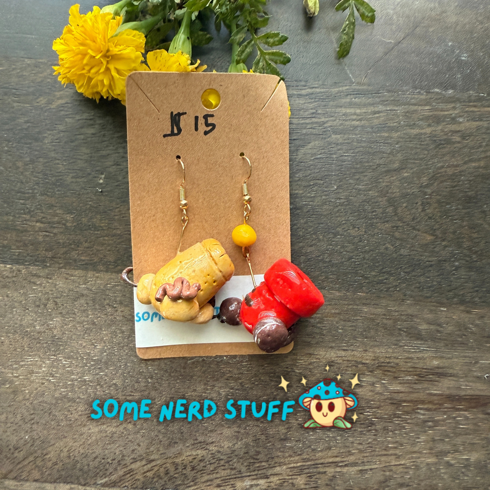 Cookie and candy cannon earrings that are bursting with color, and one candy cannon ball sold on SomeNerdStuff.com