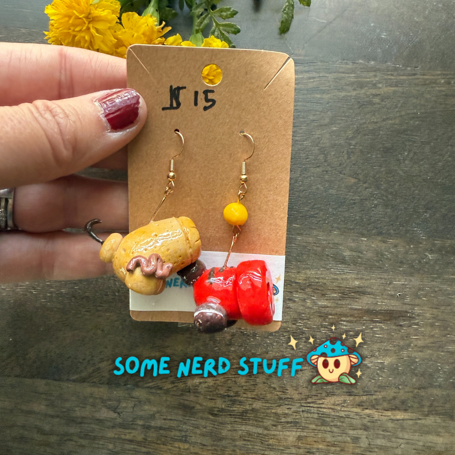 Cookie and candy cannon earrings that are bursting with color, and one candy cannon ball sold on SomeNerdStuff.com