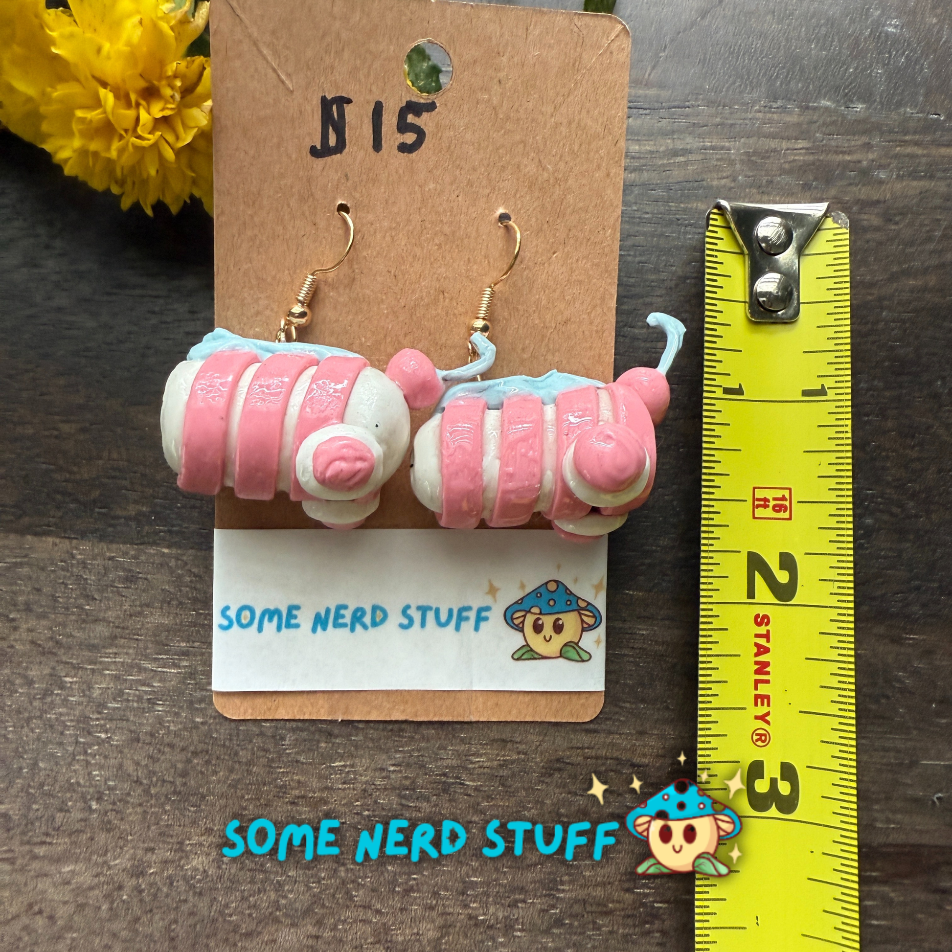 Candy peppermint swirl polymer clay earrings sold on somenerdstuff.com pink and white stripped faux candy for measuring