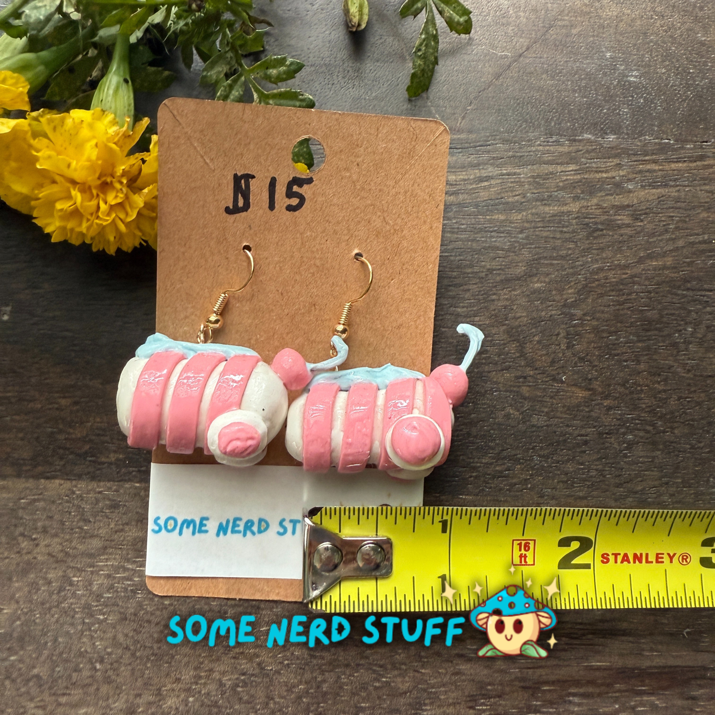 Candy peppermint swirl polymer clay earrings sold on somenerdstuff.com pink and white stripped faux candy for measuring