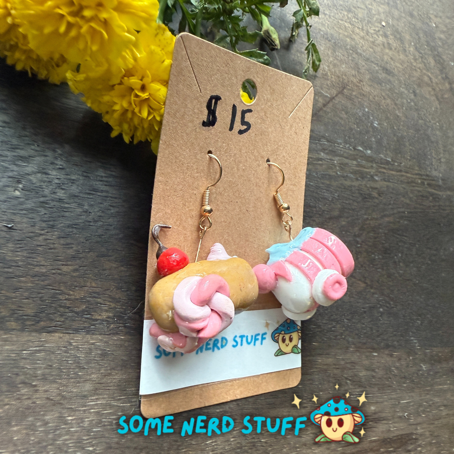 Pair of Candy Cannons Cherry topped and pepermin swirl polymer clay dangles from SomeNerdStuff side view