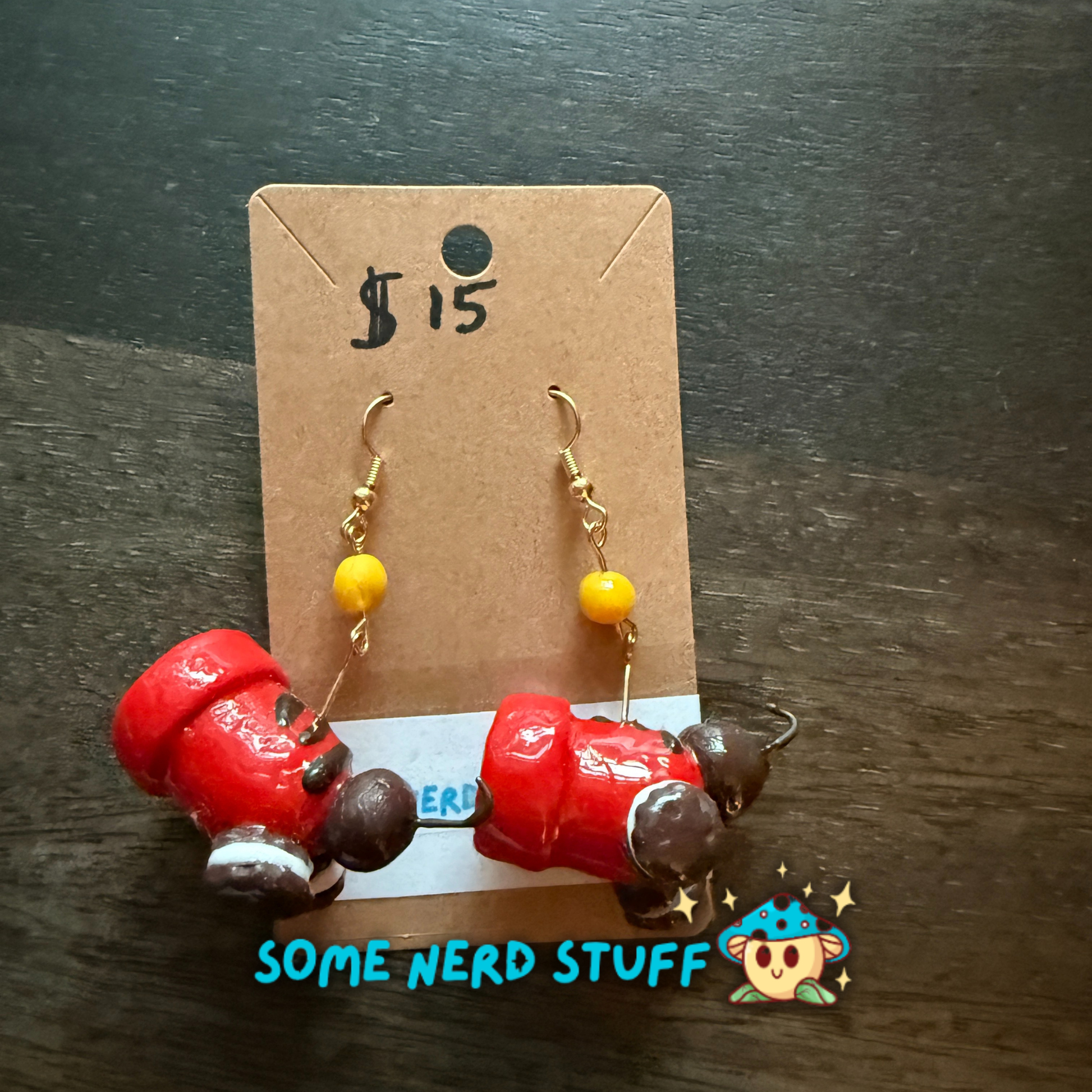 Red candy cannon and oreo cookie polymer clay earrings with cannon ball cady dangle sold on SomeNerdStuff