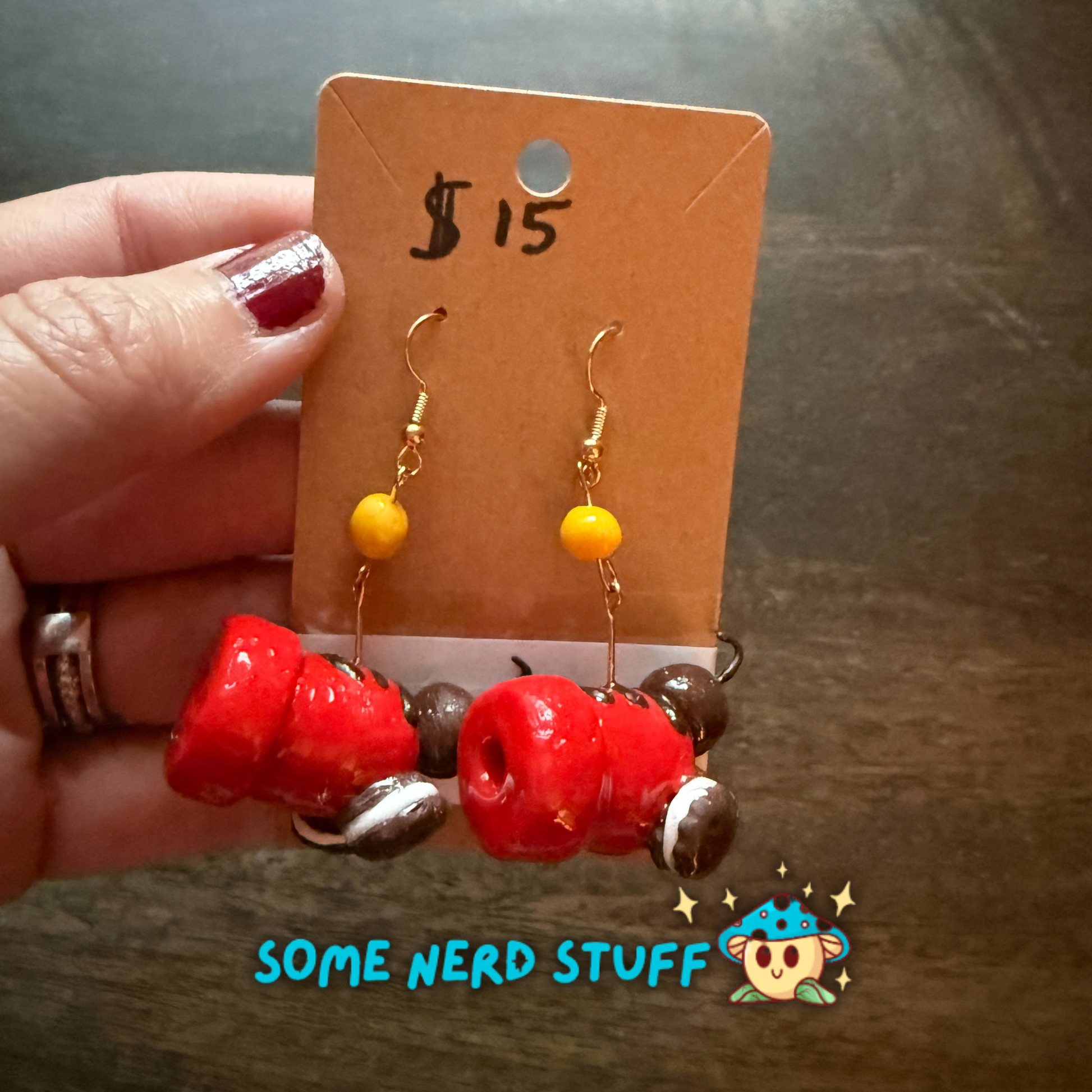 Red candy cannon and oreo cookie polymer clay earrings with cannon ball cady dangle sold on SomeNerdStuff