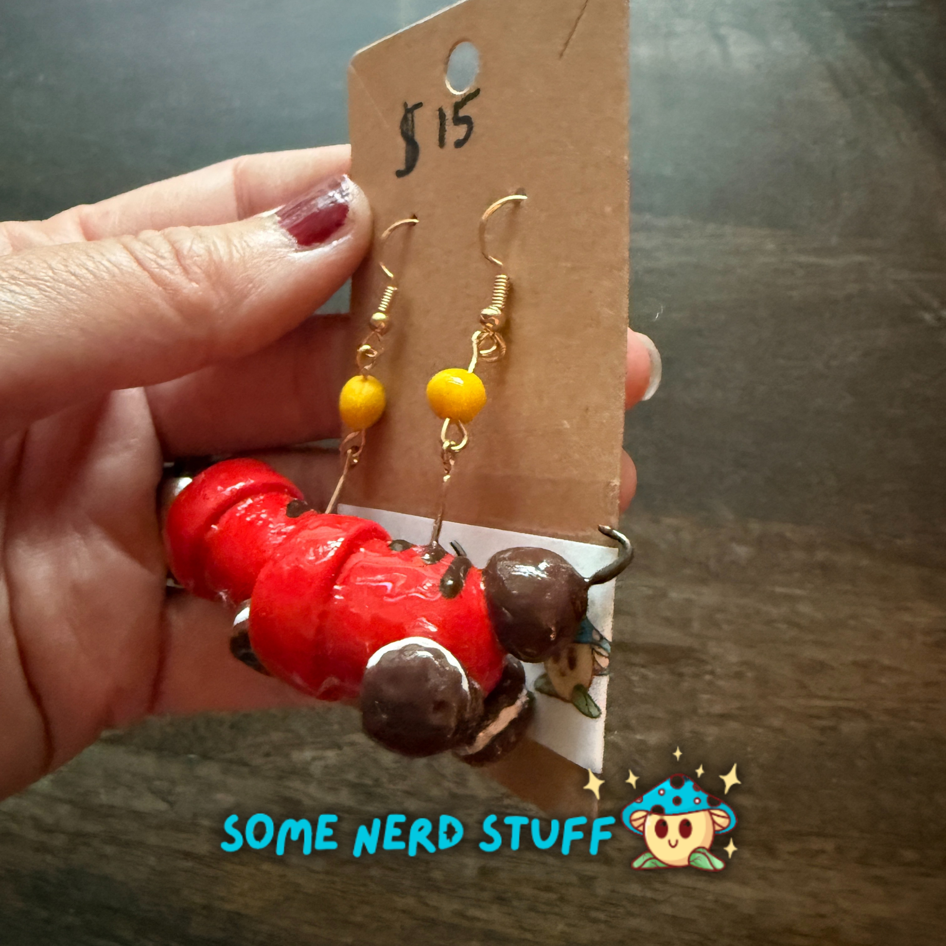 Red candy cannon and oreo cookie polymer clay earrings with cannon ball cady dangle sold on SomeNerdStuff