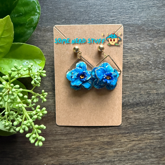 Manga Frieren: Beyond Journey's End Inspired Blue Moon Flower Polymer clay  with gold highlighted earrings made by SomeNerdStuff