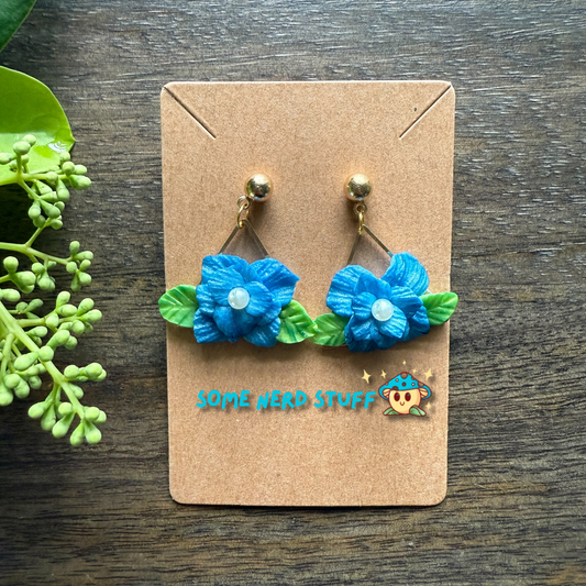 Manga Frieren: Beyond Journey's End Inspired Blue Moon Flower Polymer clay and pearl earrings made by SomeNerdStuff