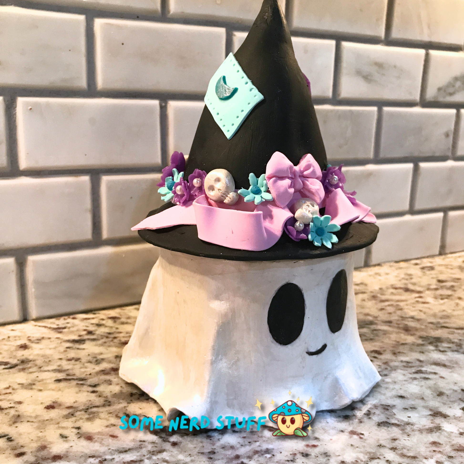 Ghost stash jar, that has a witch hat that brings to life patches, ribbon, flowers, cute skulls, showing side of ghost jar.