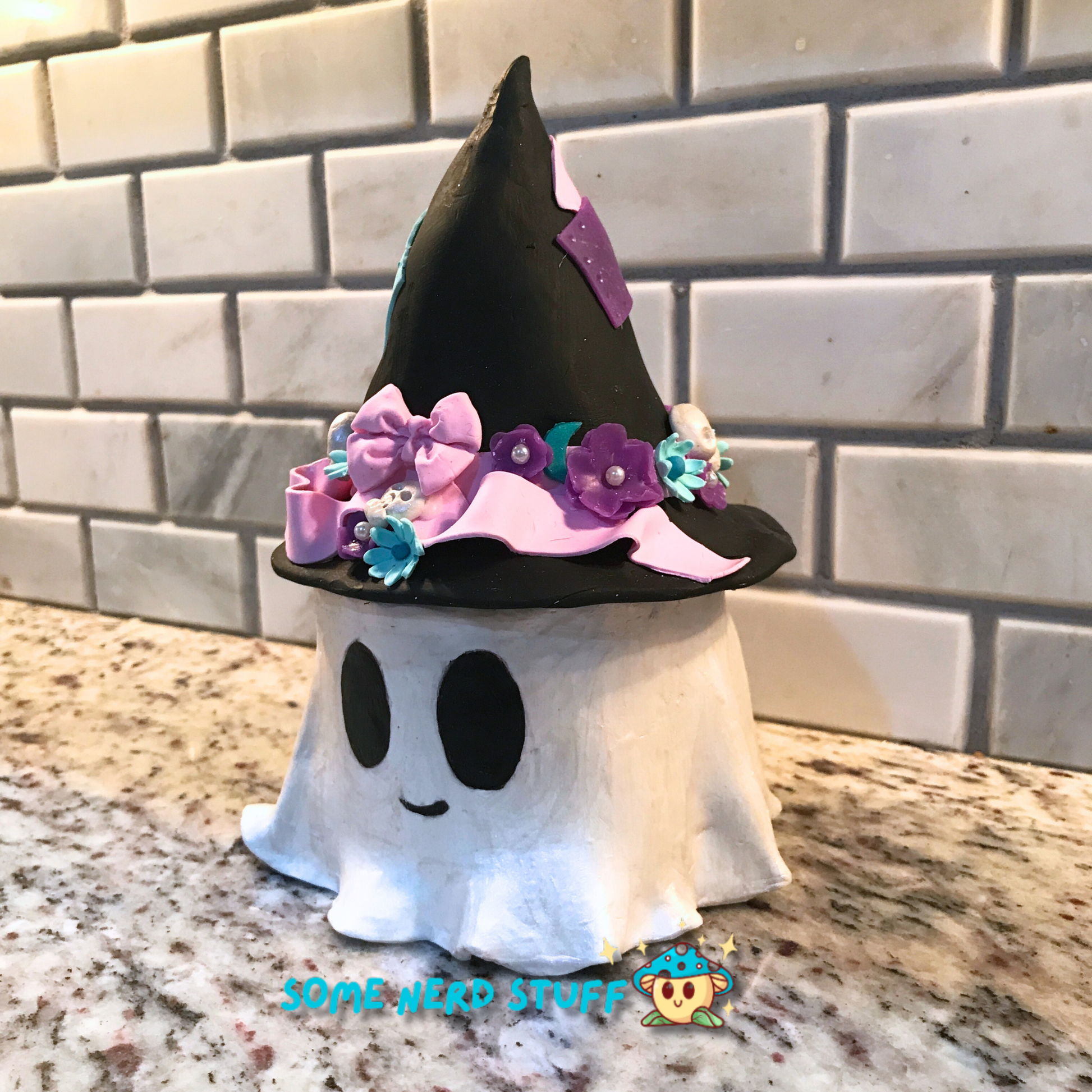 Ghost stash jar, that has a witch hat that brings to life patches, ribbon, flowers, cute skulls, and showing side of product.