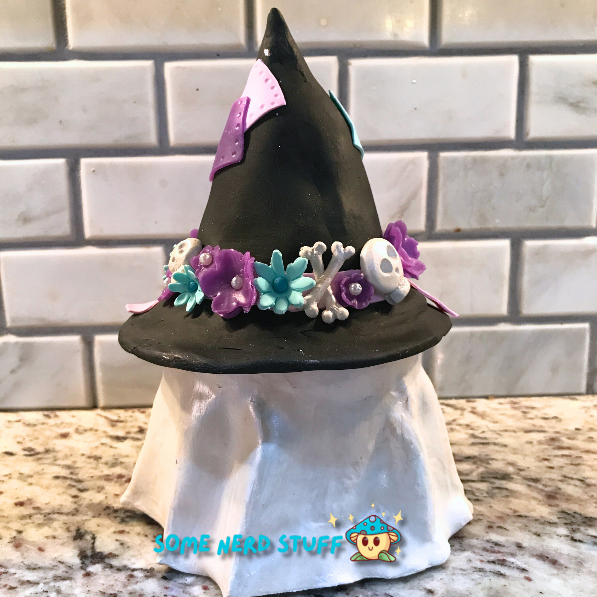 Ghost stash jar, that has a witch hat that brings to life patches, ribbon, flowers, cute skulls, showing back of product.