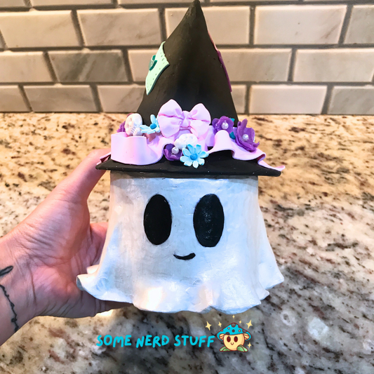 Ghost stash jar, that has a witch hat that brings to life patches, ribbon, flowers, cute skulls, and show in had for size.