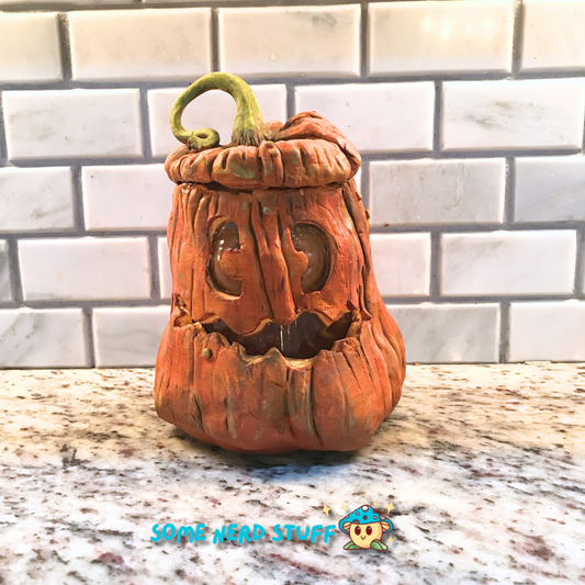 Pumpkin trinket or stash jar made out of polymer clay front view of product.