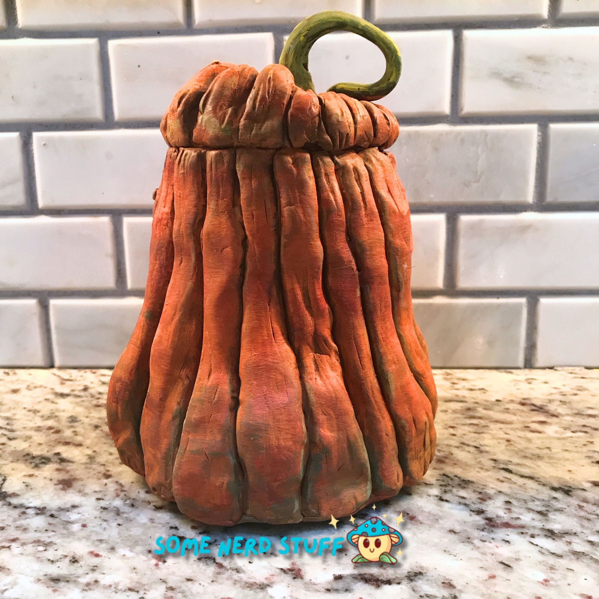 Pumpkin trinket or stash jar made out of polymer clay back of view for product.