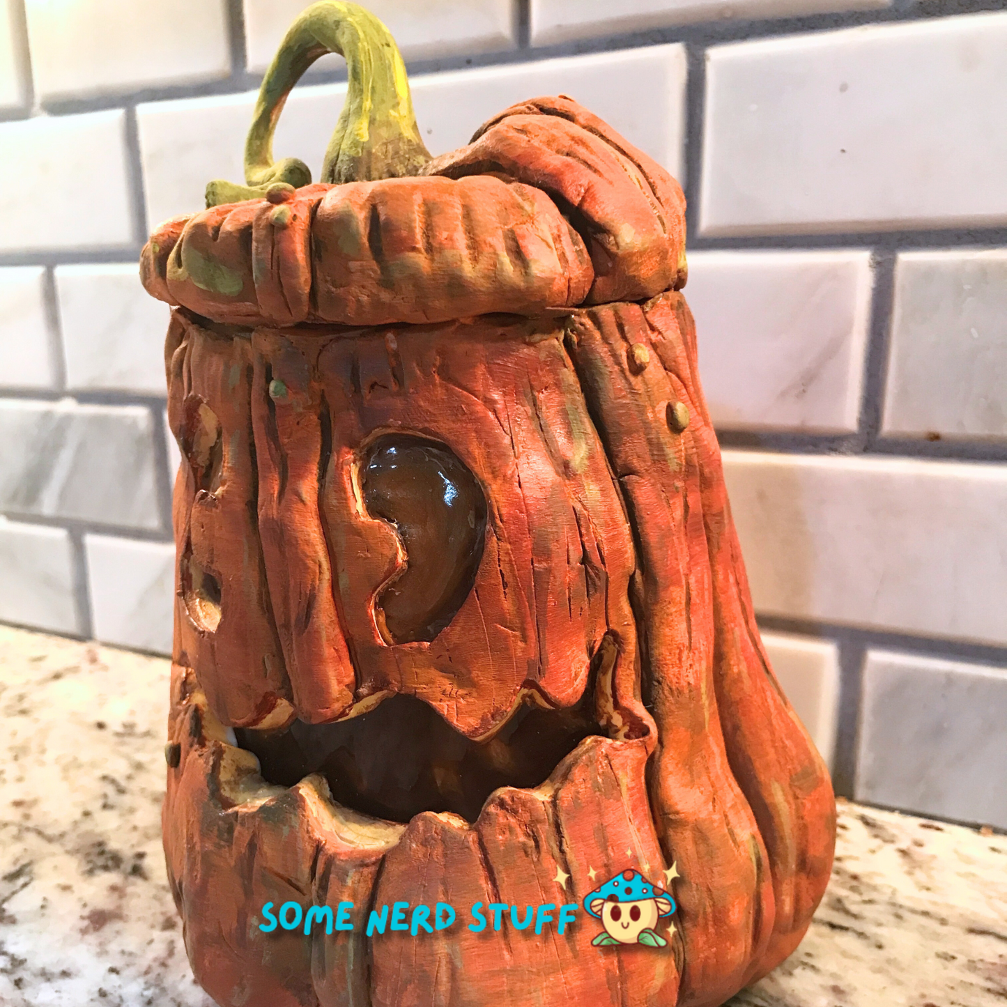 Pumpkin trinket or stash jar made out of polymer clay additional side view of product.