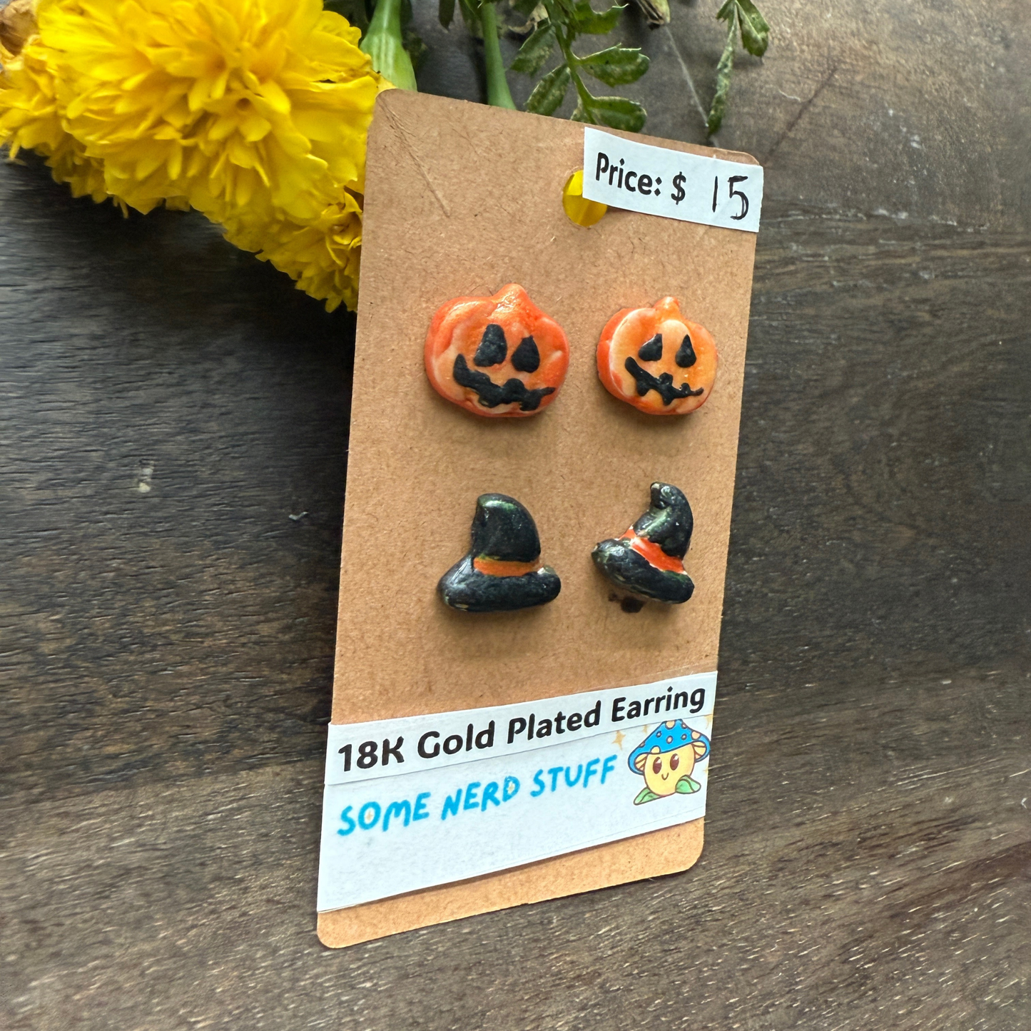 Pumpkin and black hat polymer clay hand made earrings that are 18k plated sold at somenerdstuff