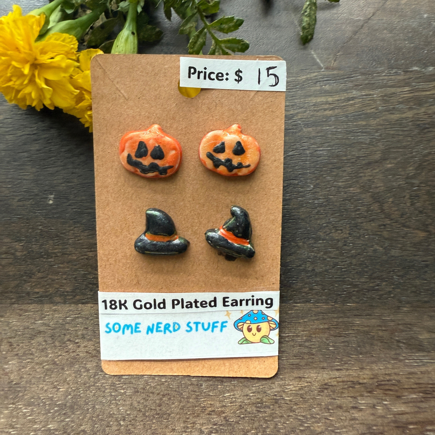 Pumpkin and black hat polymer clay hand made earrings that are 18k plated sold at somenerdstuff