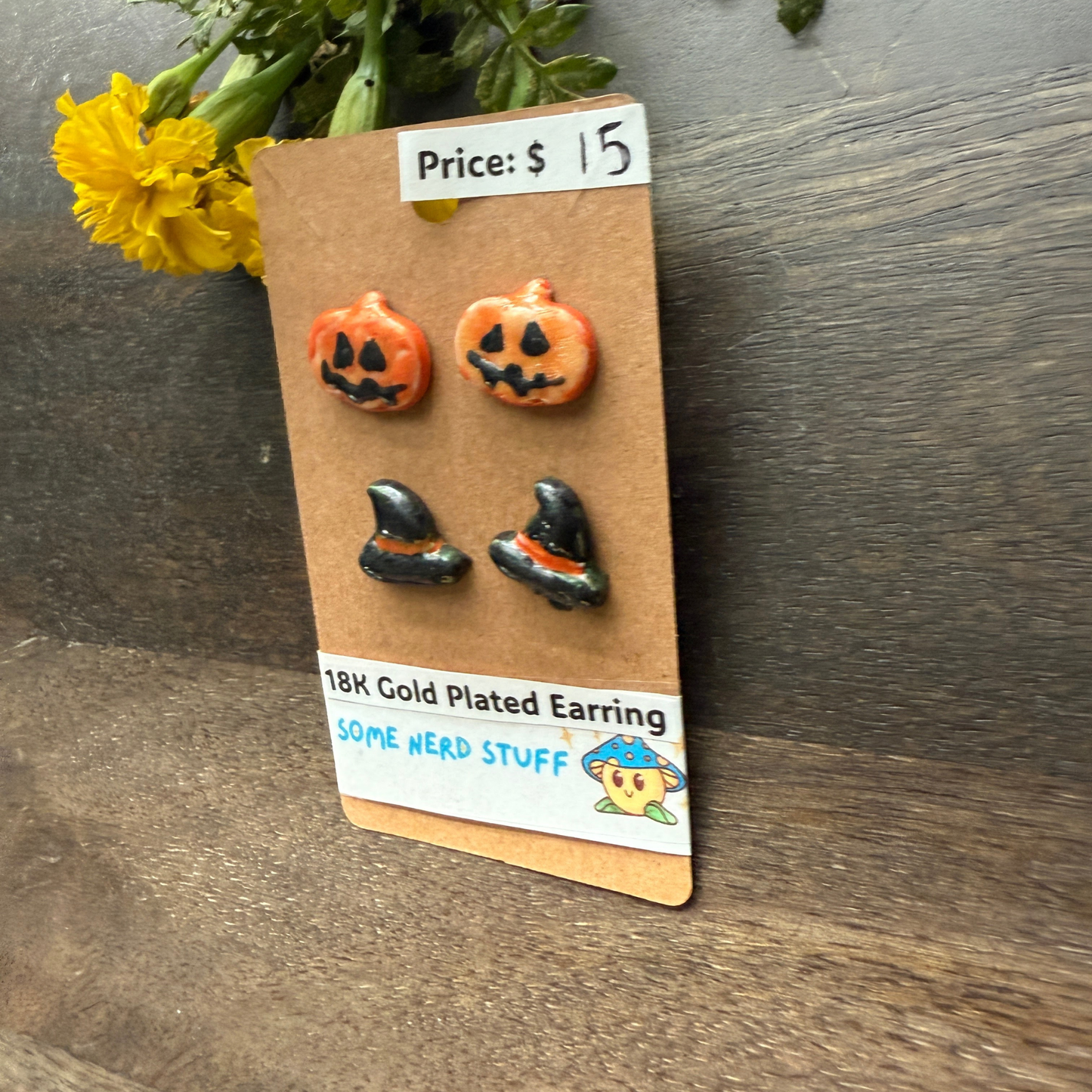 Pumpkin and black hat polymer clay hand made earrings that are 18k plated sold at somenerdstuff
