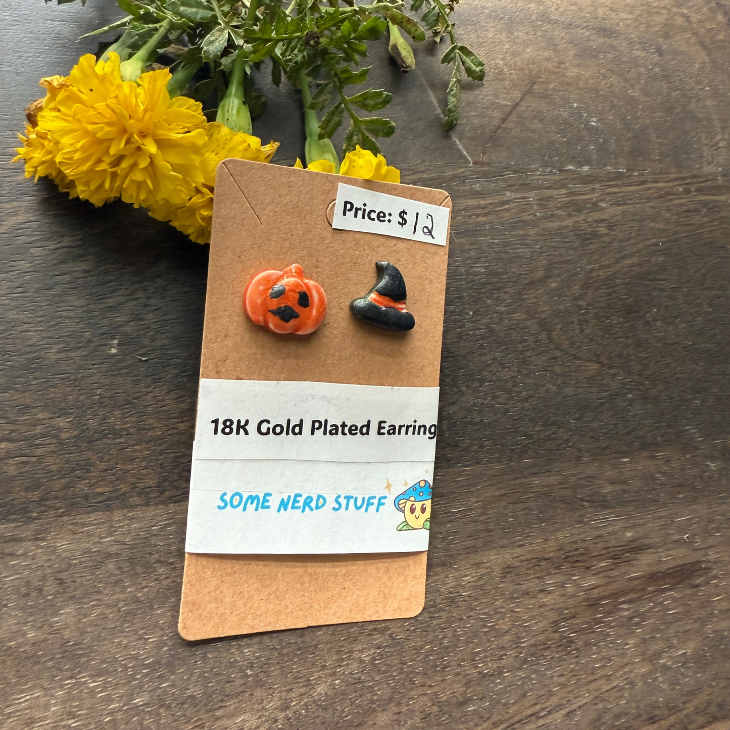 Pumpkin and black hat polymer clay hand made earrings that are 18k plated sold at somenerdstuff