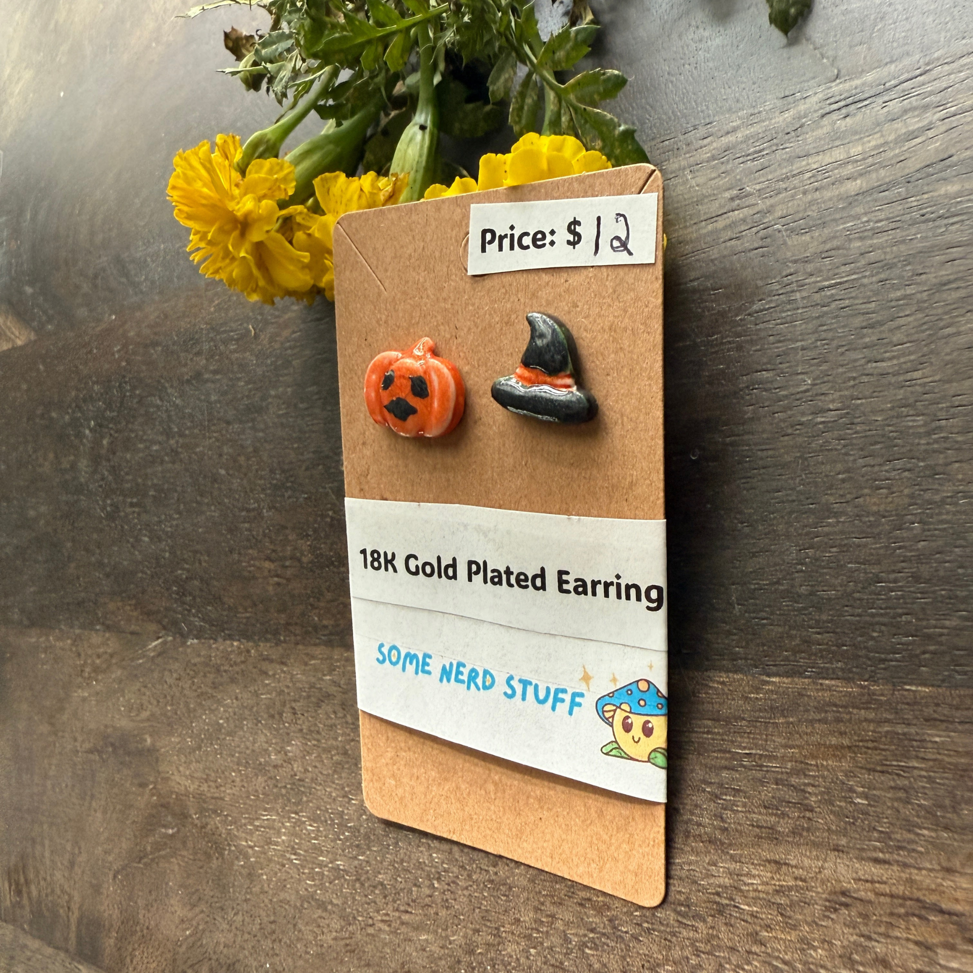 Pumpkin and black hat polymer clay hand made earrings that are 18k plated sold at somenerdstuff