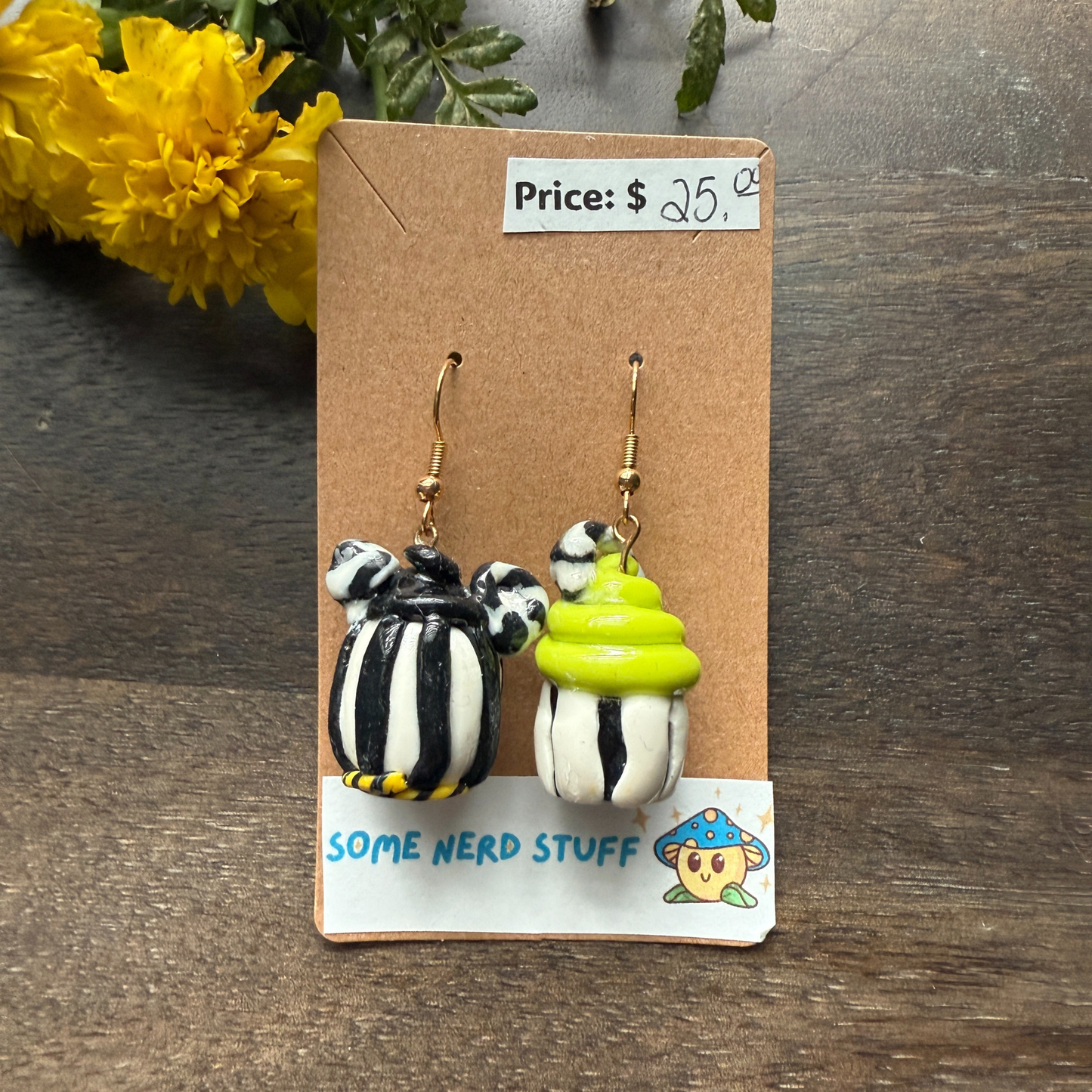 Pair of Nightmare before Christmas themed polymer clay earrings sold by SomeNerdStuff