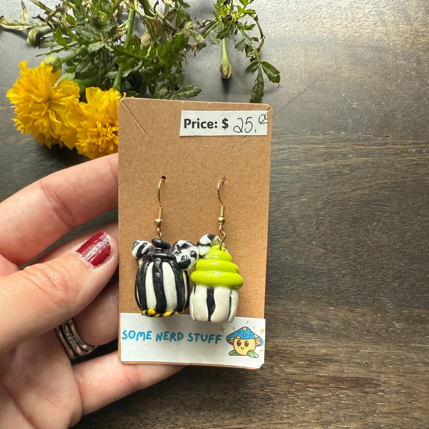 Pair of Nightmare before Christmas themed polymer clay earrings sold by SomeNerdStuff