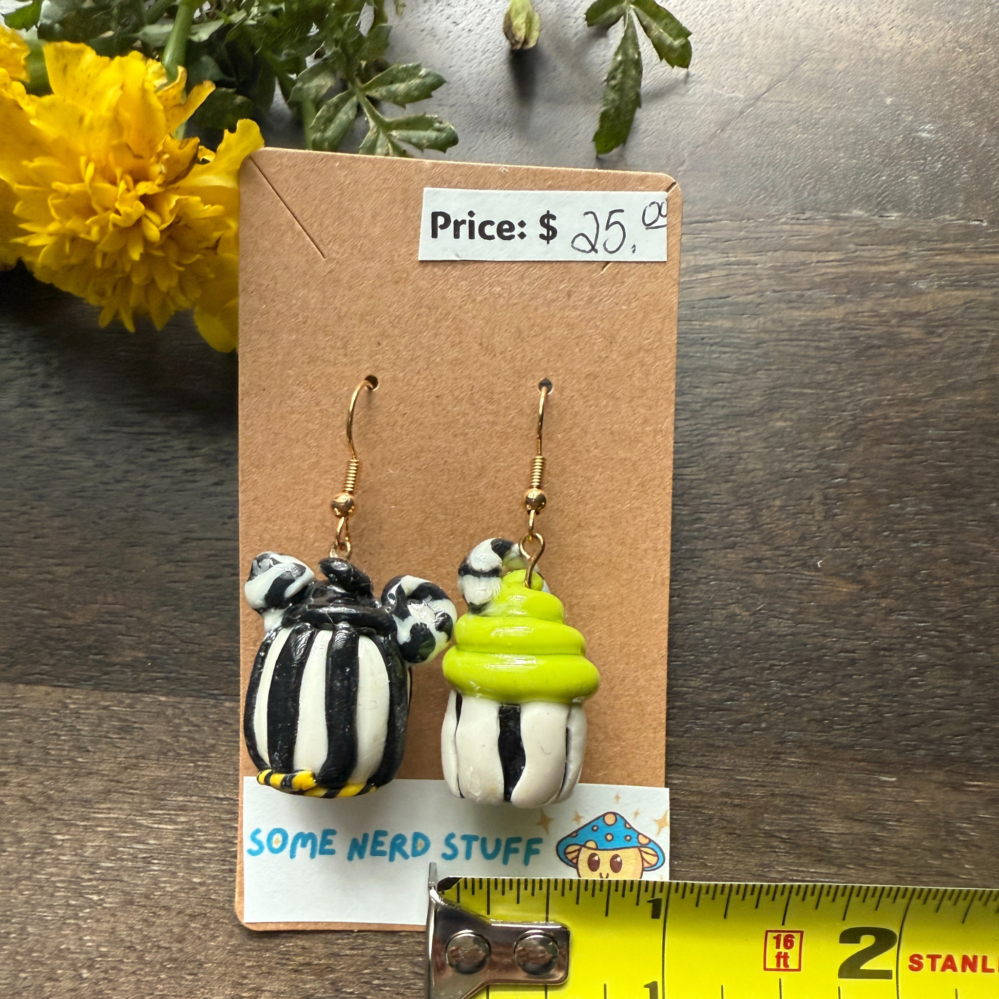 Pair of Nightmare before Christmas themed polymer clay earrings sold by SomeNerdStuff