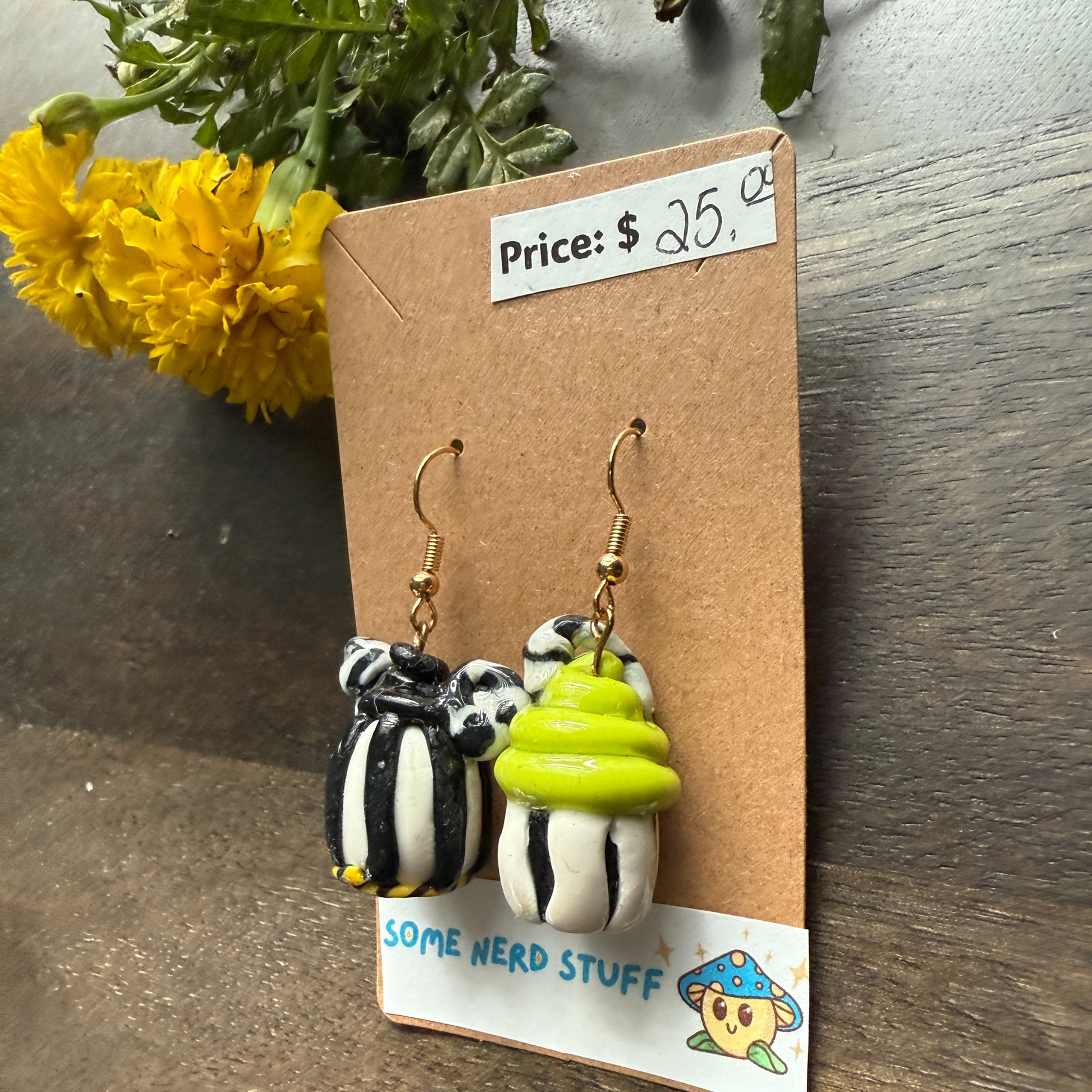 Pair of Nightmare before Christmas themed polymer clay earrings sold by SomeNerdStuff