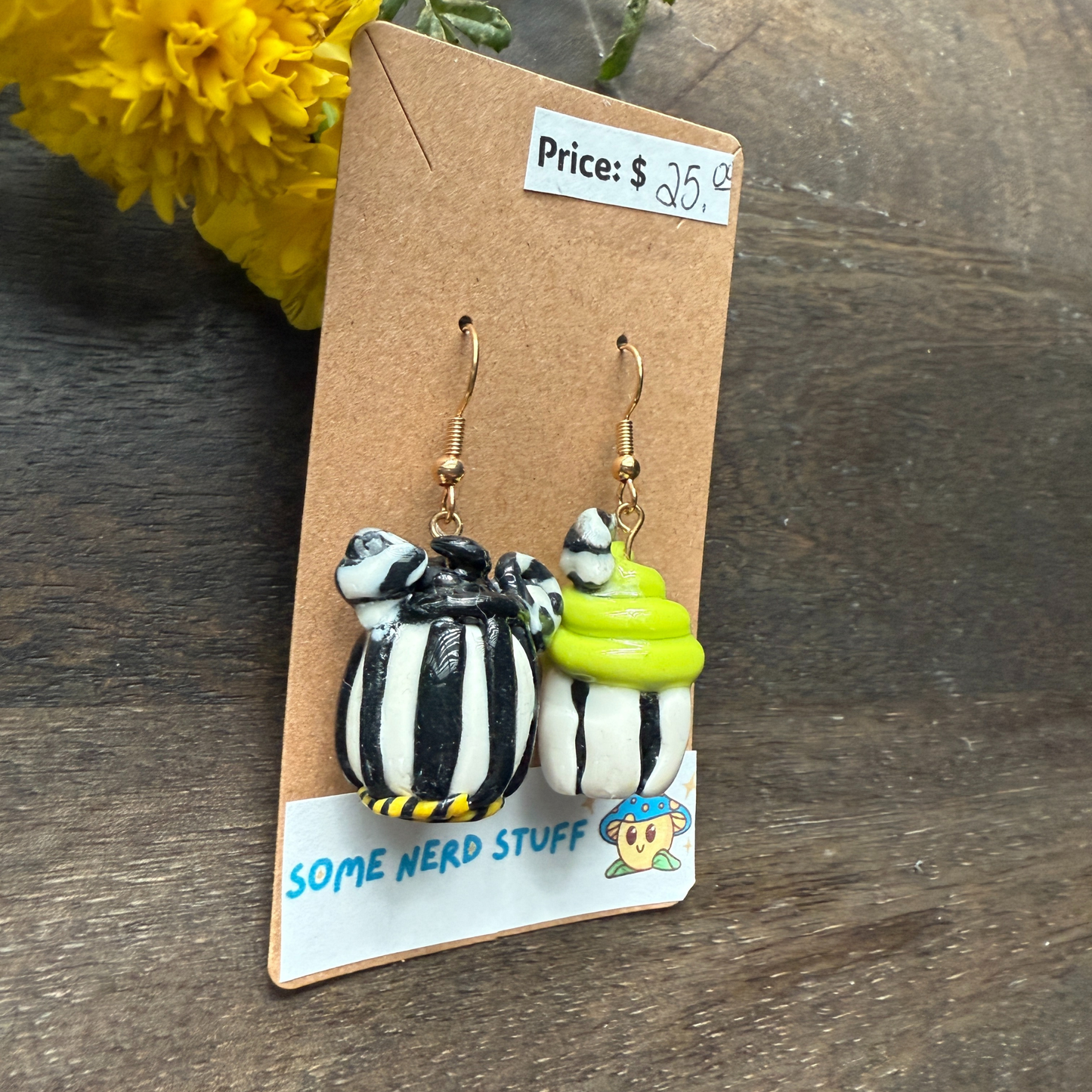 Pair of Nightmare before Christmas themed polymer clay earrings sold by SomeNerdStuff