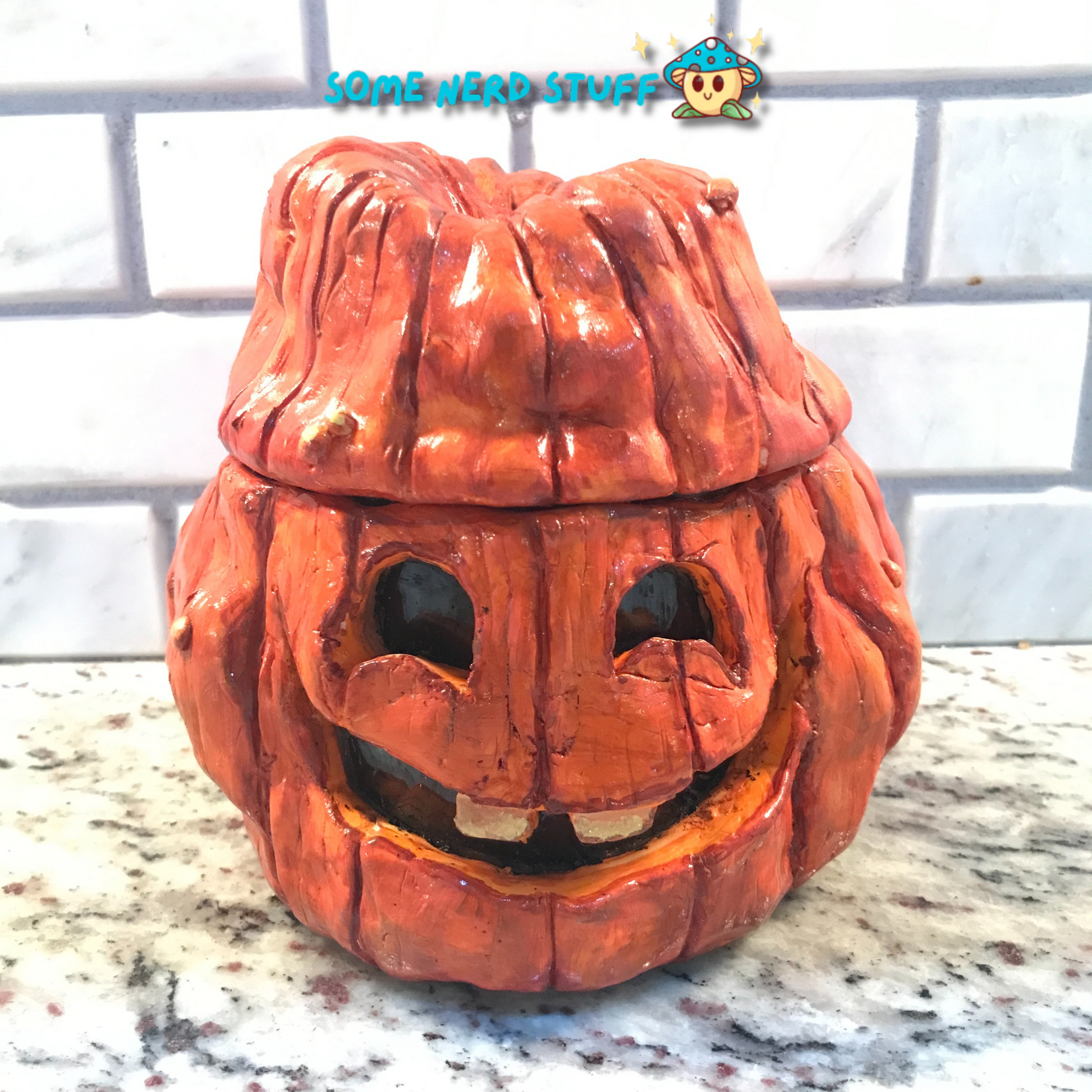Polymer Clay pumpkin stash jar with lid and facing smiling Jolly Jack made by SomeNerdStuff