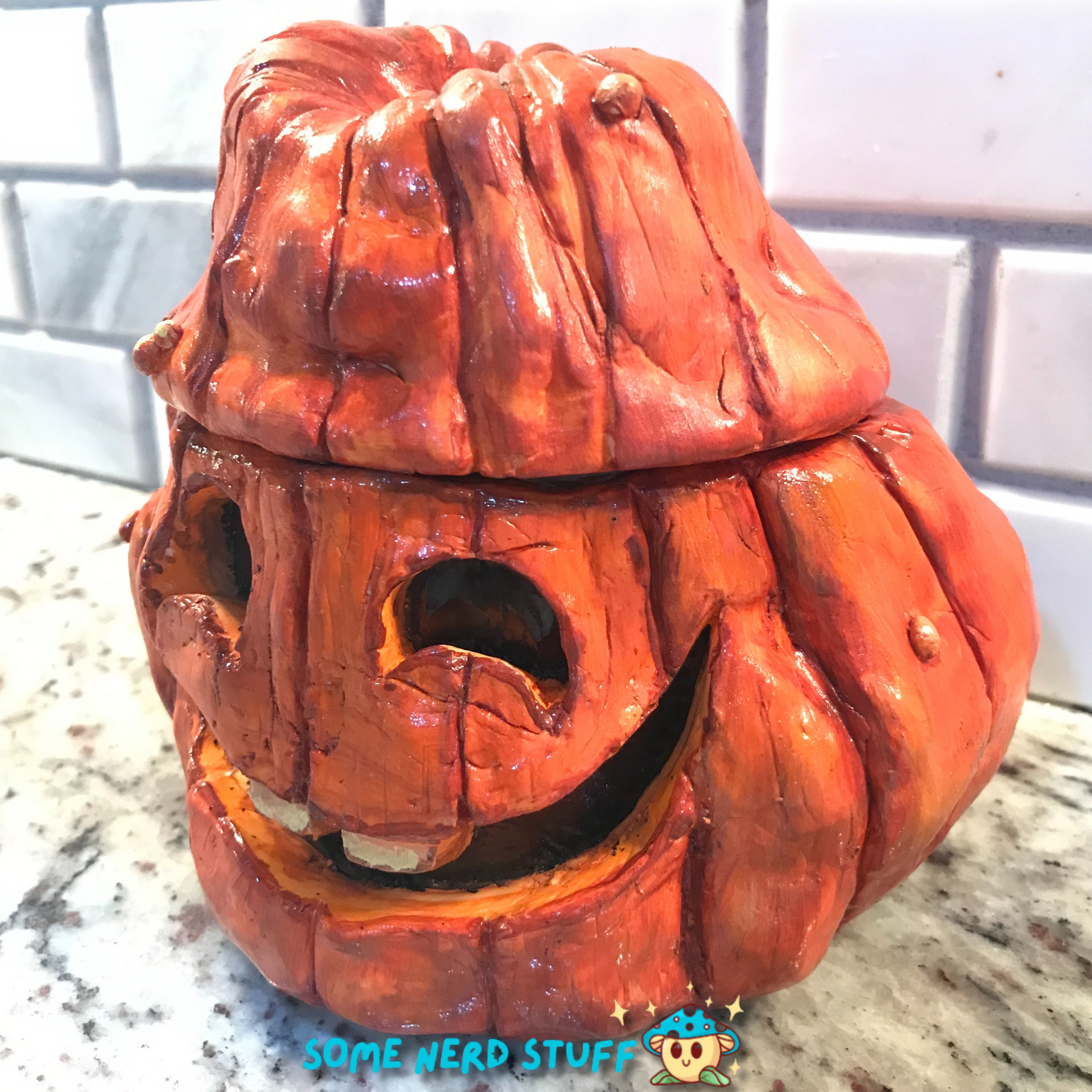 Polymer Clay pumpkin stash jar with lid and facing smiling Jolly Jack side view made by SomeNerdStuff