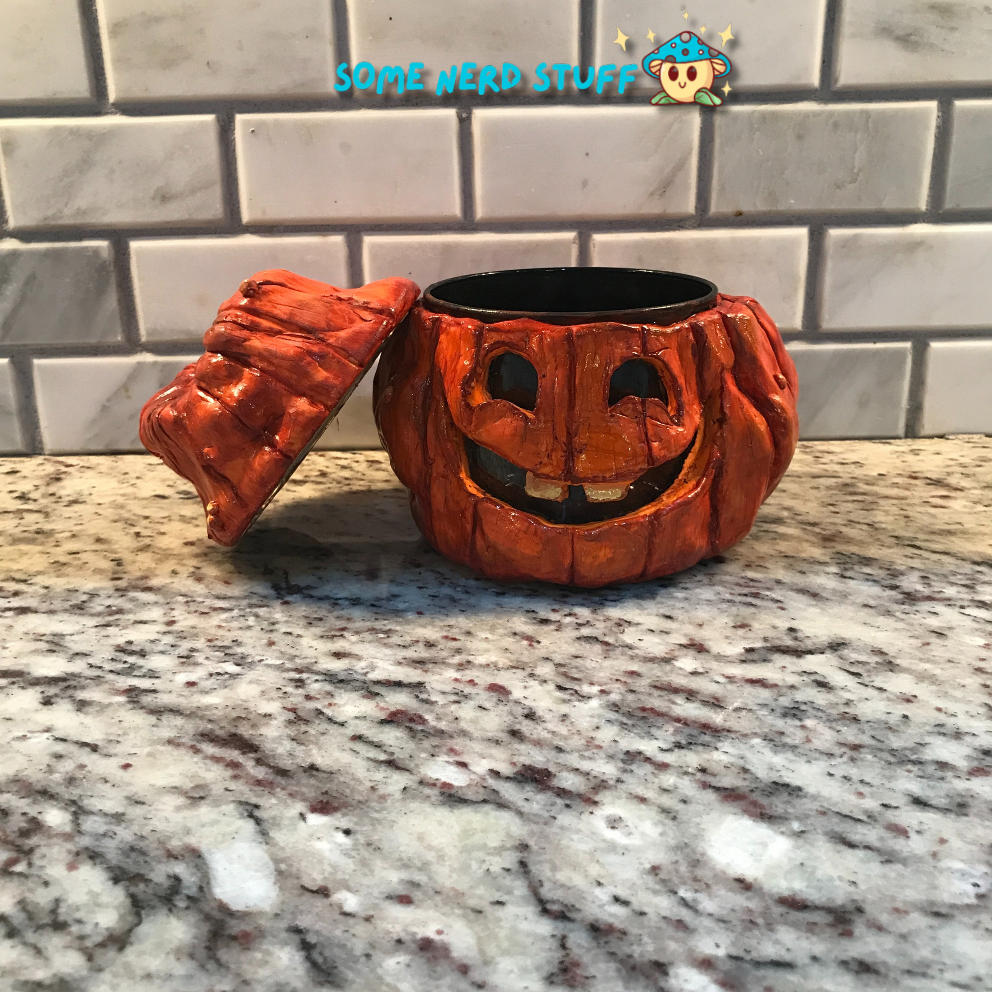 Polymer Clay pumpkin stash jar with lid and facing smiling Jolly Jack made by SomeNerdStuff