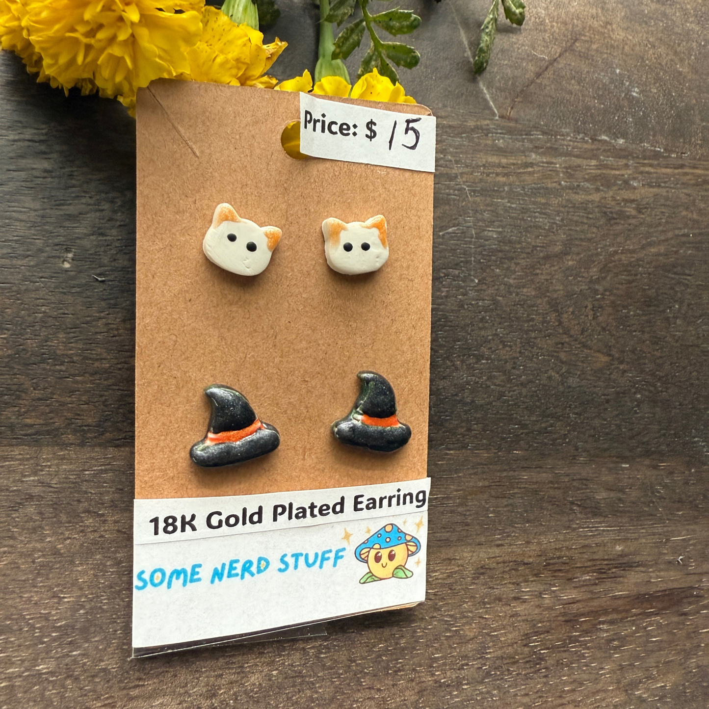 Halloween Cat and Witch hat studs that are 18k plated sold by SomeNerdStuff Halooween themed
