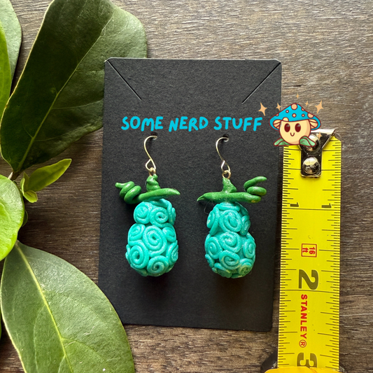 Omo Omo No Mi - Devil Fruit One Piece Earrings shown with measuring tape for size