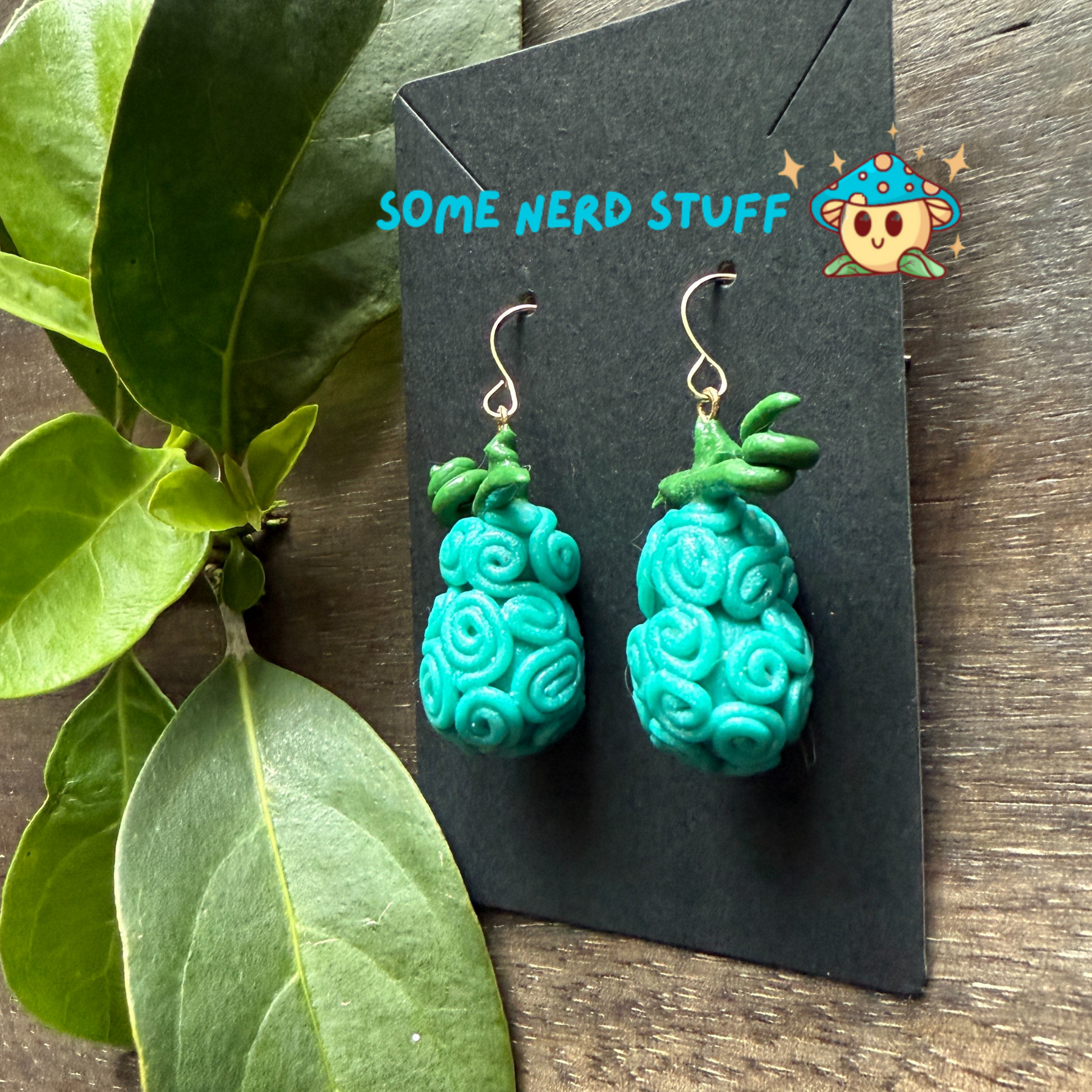Omo Omo No Mi - Devil Fruit One Piece Earrings by somenerd stuff showing side of polymer clay earring