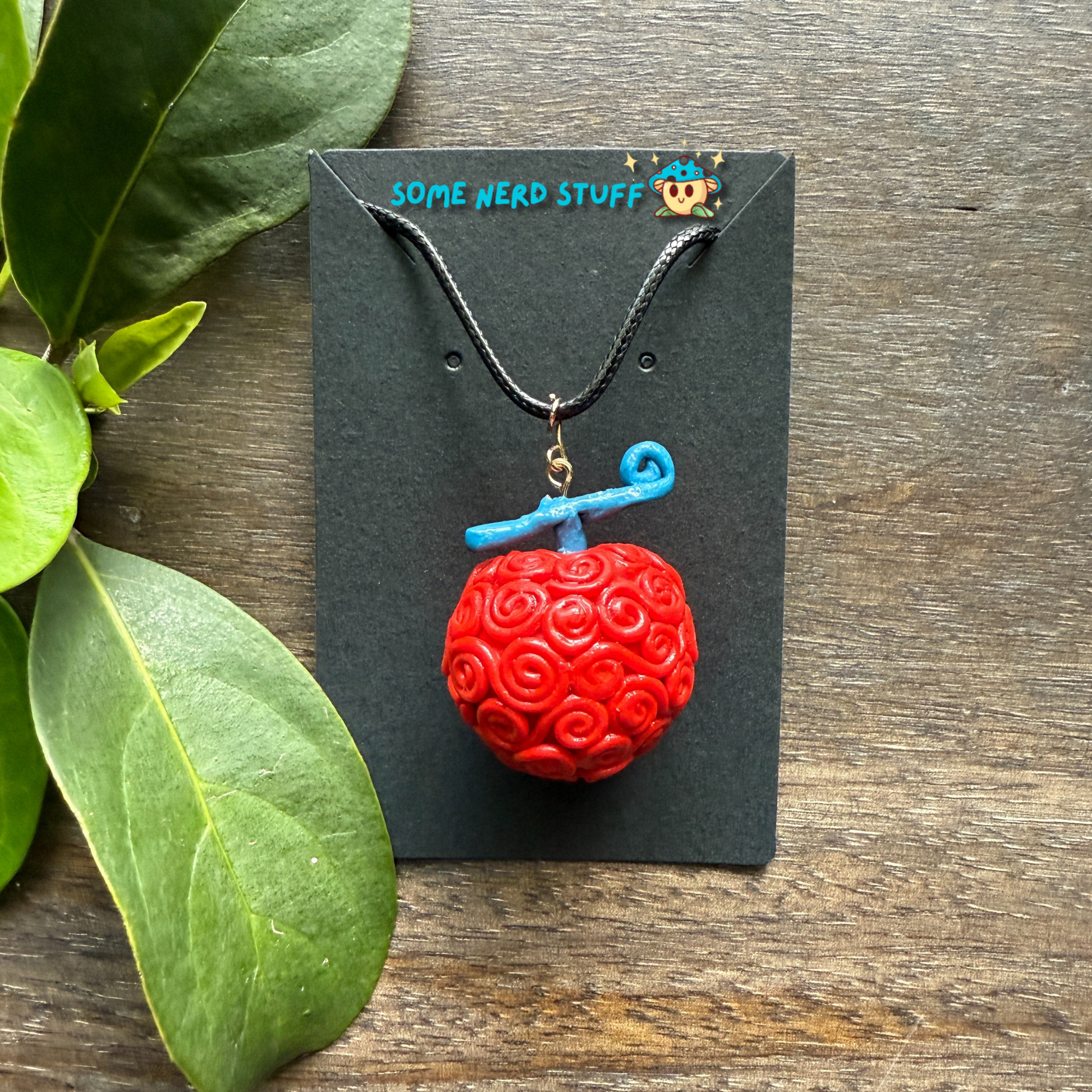 Ope Ope no Mi Necklace charm showing details of devil fruit necklace made by SomeNerdStuff
