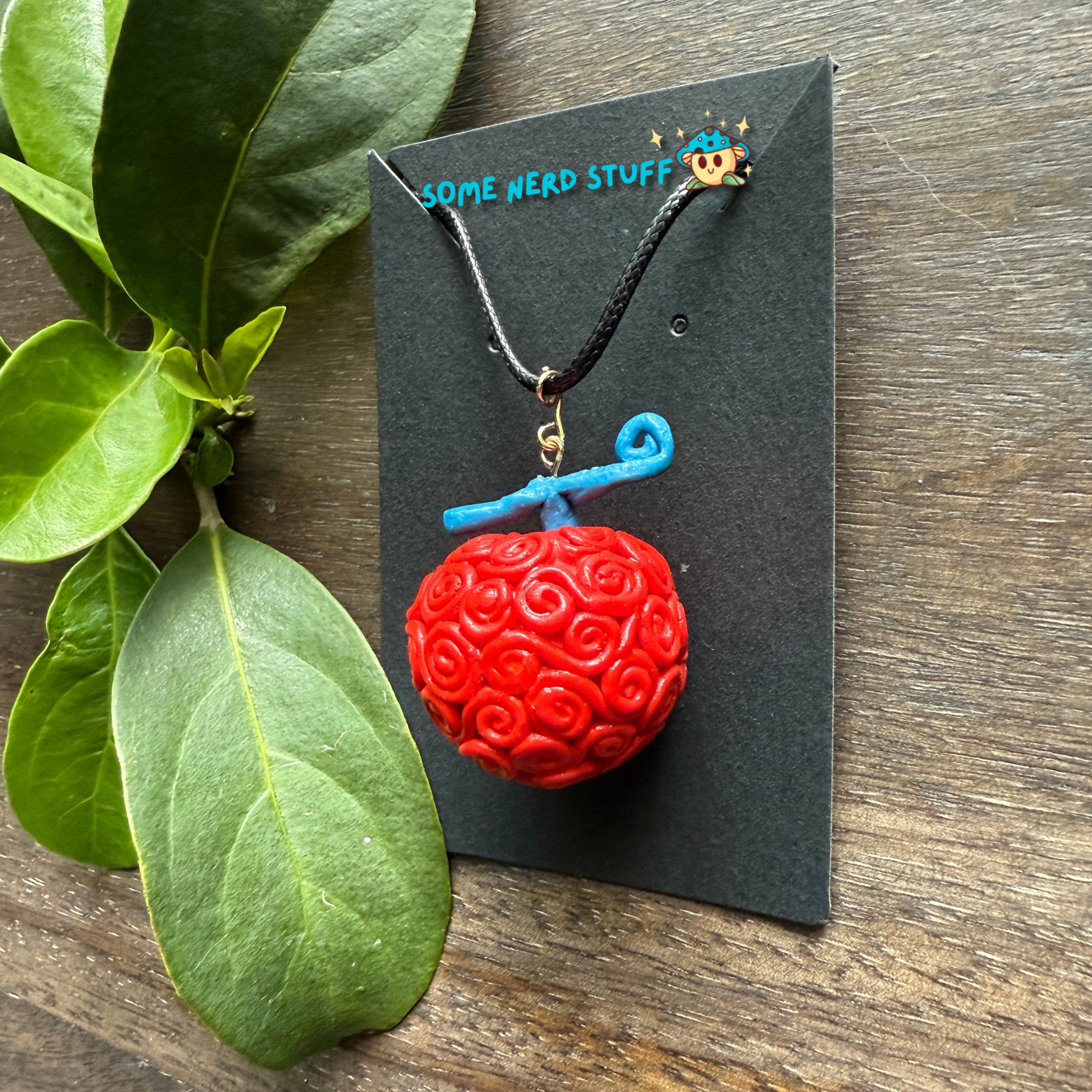 Ope Ope no Mi Necklace charm showing side video of necklace made by SomeNerdStuff