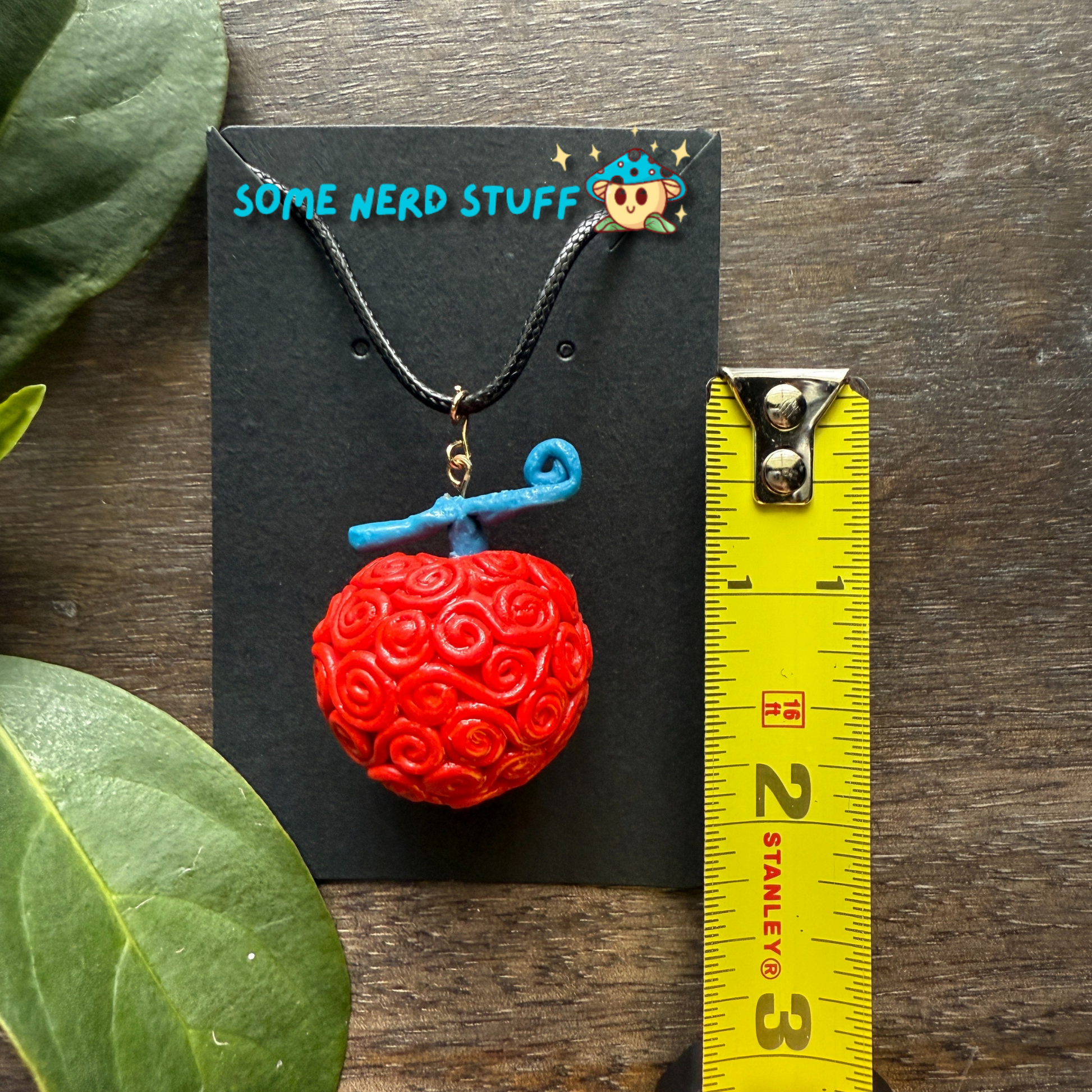 Ope Ope no Mi Necklace charm showing size of necklace made by SomeNerdStuff