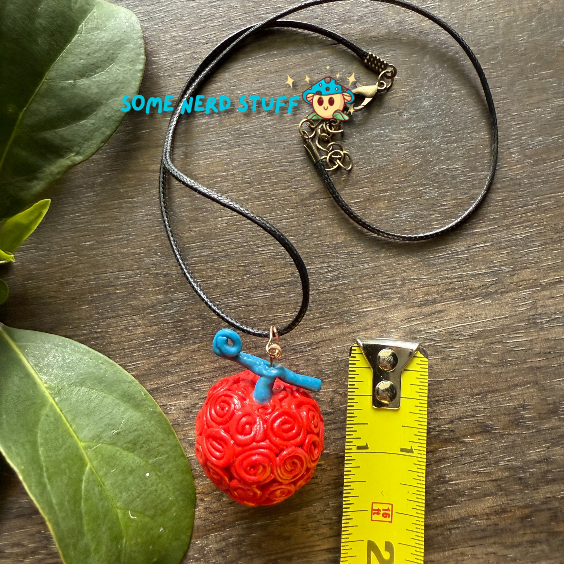 Ope Ope no Mi Necklace charm showing sze with measuring tape of necklace made by SomeNerdStuff