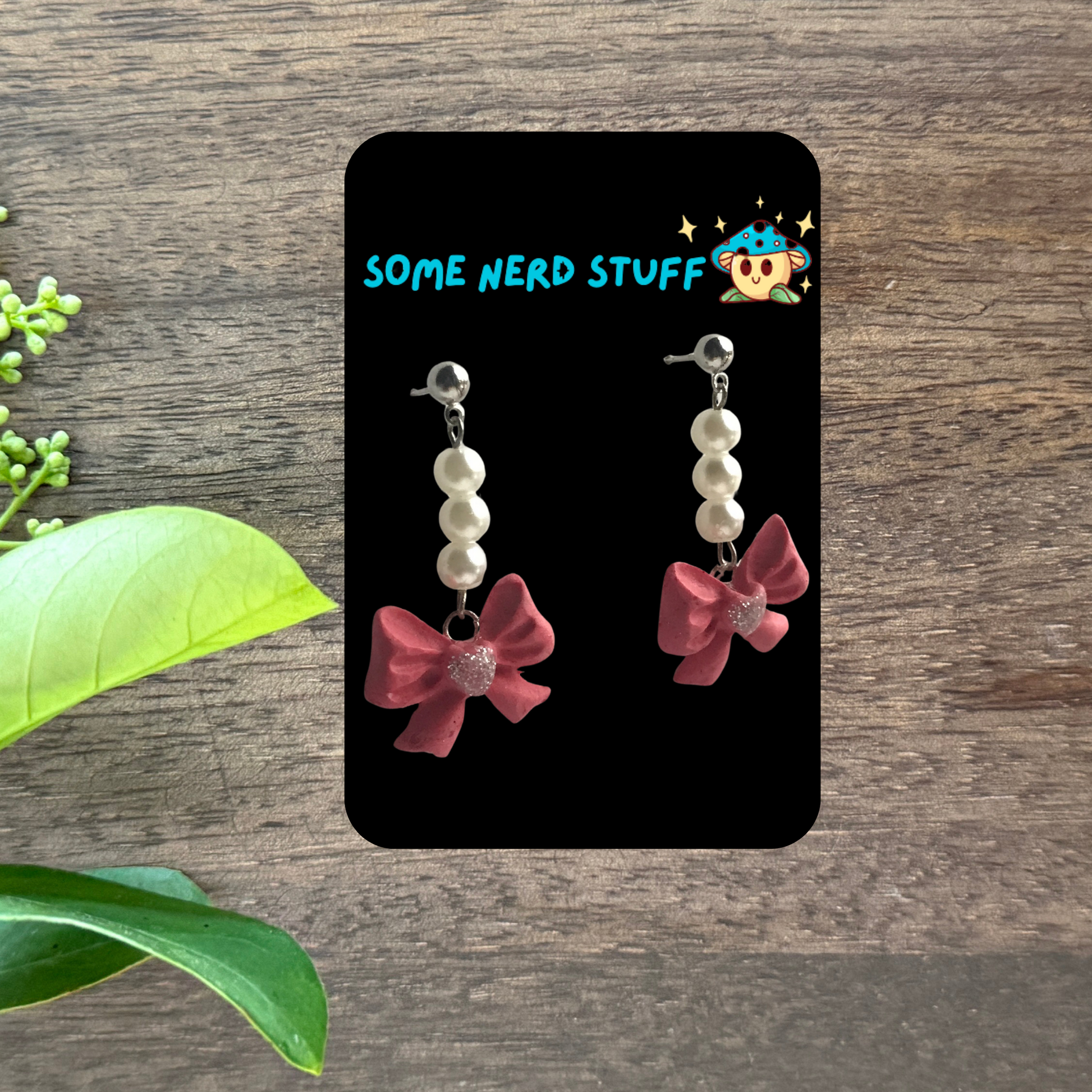 Polymer Clay pink bows with pearl danging earrings made by SomeNerdStuff