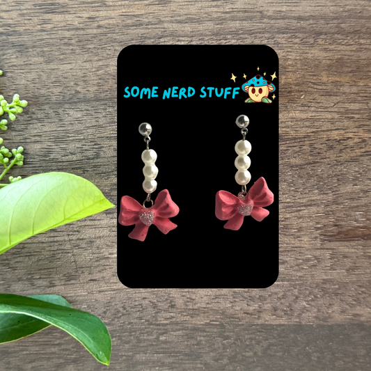 Polymer Clay pink bows with pearl danging earrings made by SomeNerdStuff
